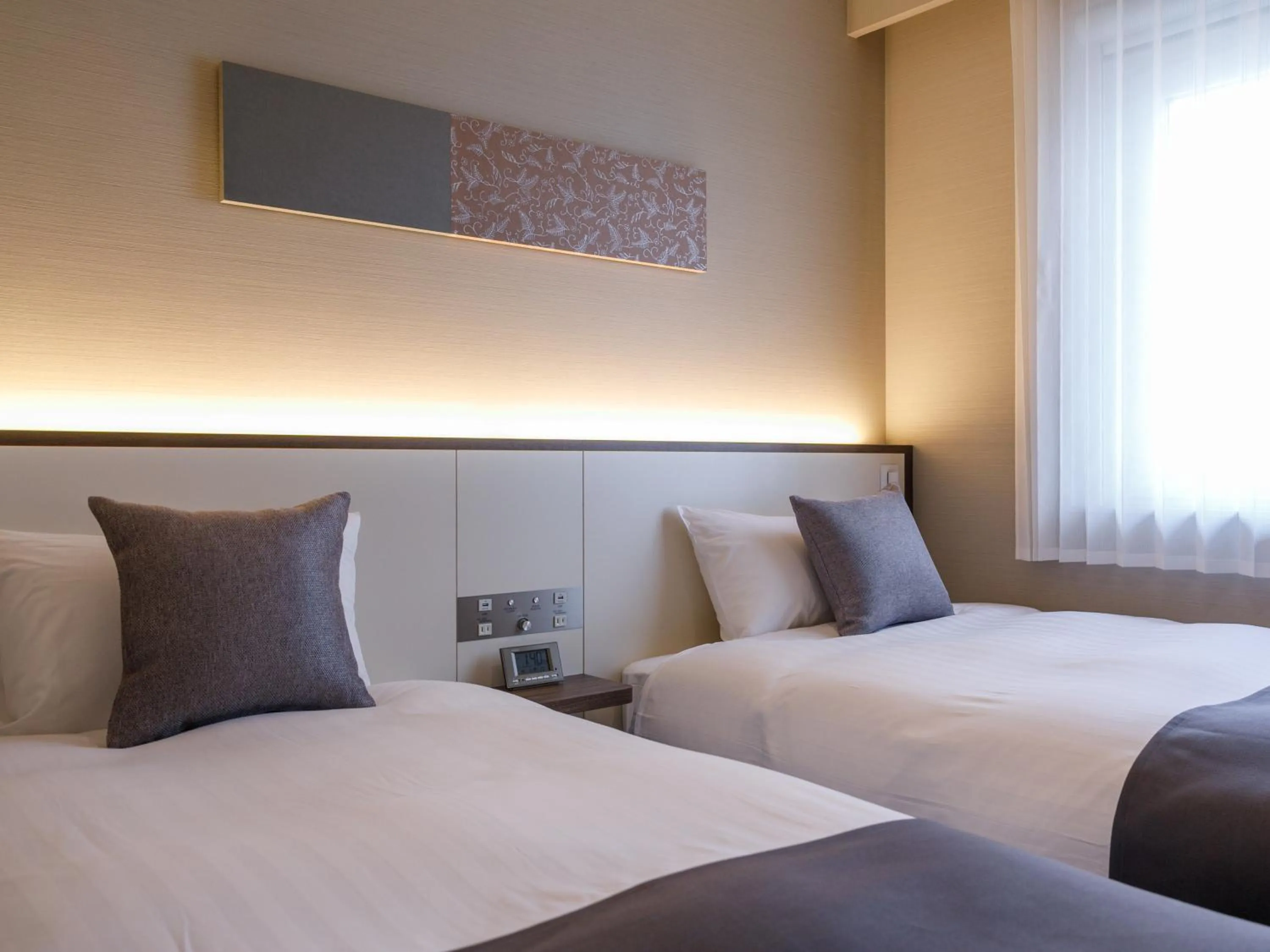 Bed in Fukuoka U-BELL Hotel