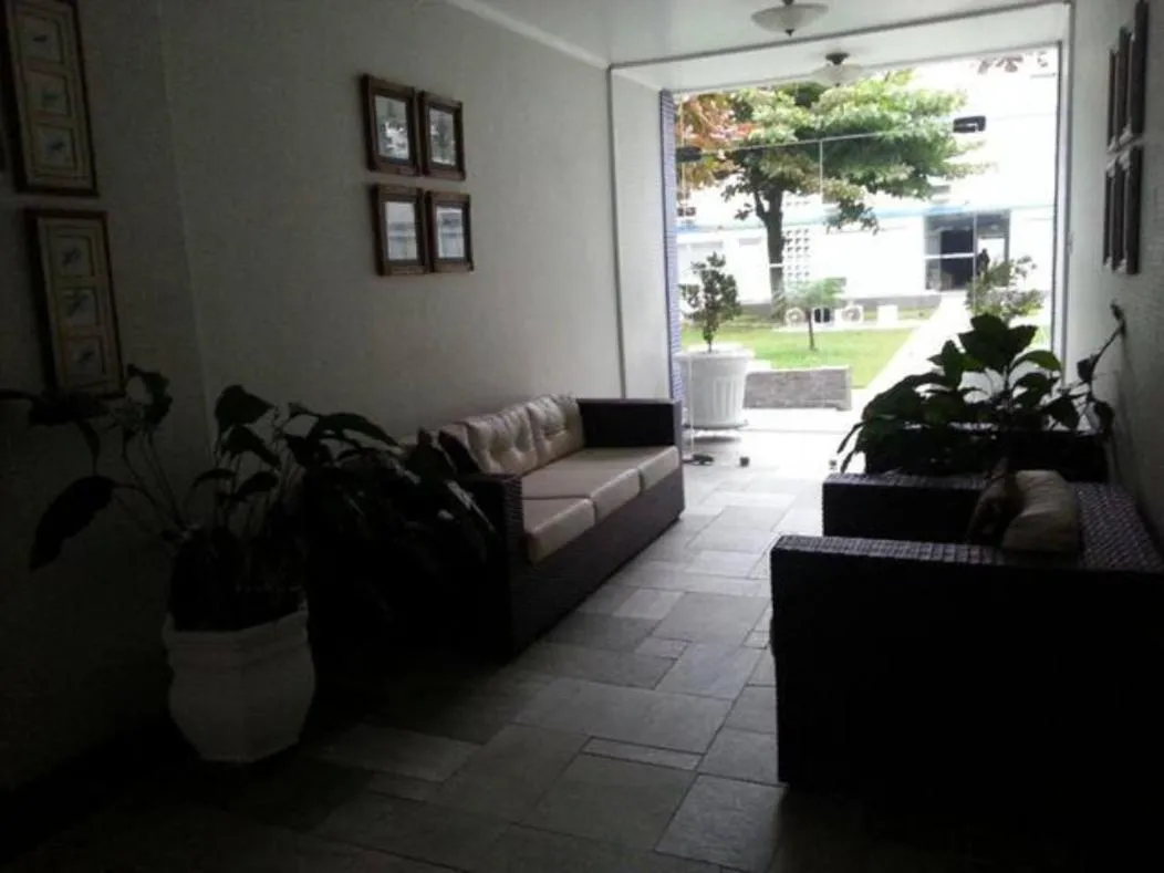 Seating area in Guarujá Enseada - Apto 200m da praia - 02 dorm. Wi-fi + AR + Estacionamento