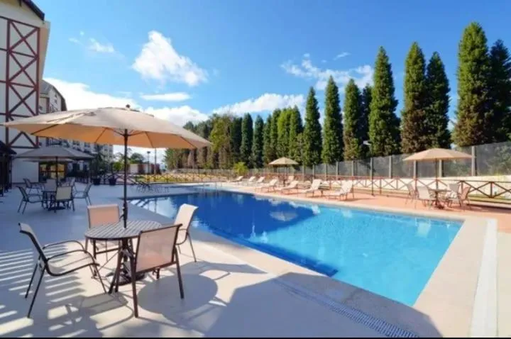 Swimming pool in Suite Cond Vista Azul em Pedra Azul - Domingos Martins