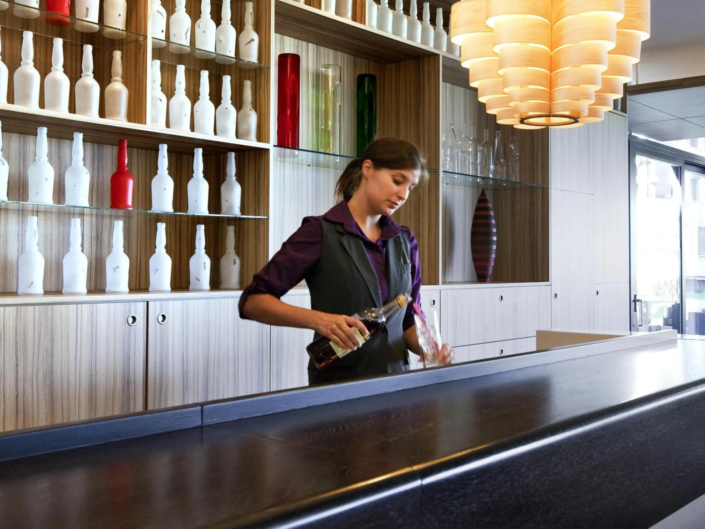 Lounge or bar in Novotel Lausanne Bussigny