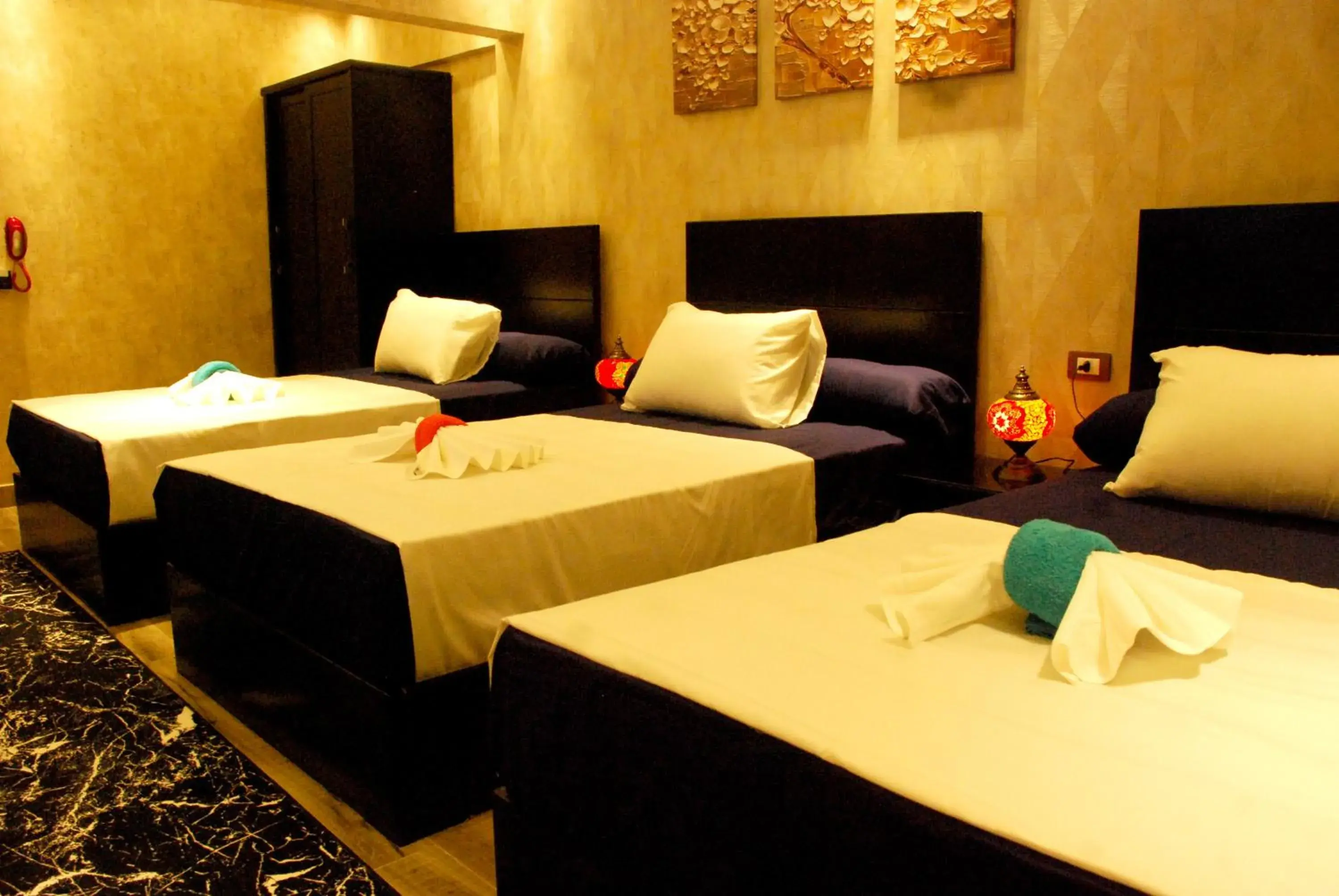 Quadruple Room with Private External Bathroom in Pyramids Planet Hotel Quadruple Room with Private External Bathroom in Pyramids Planet Hotel