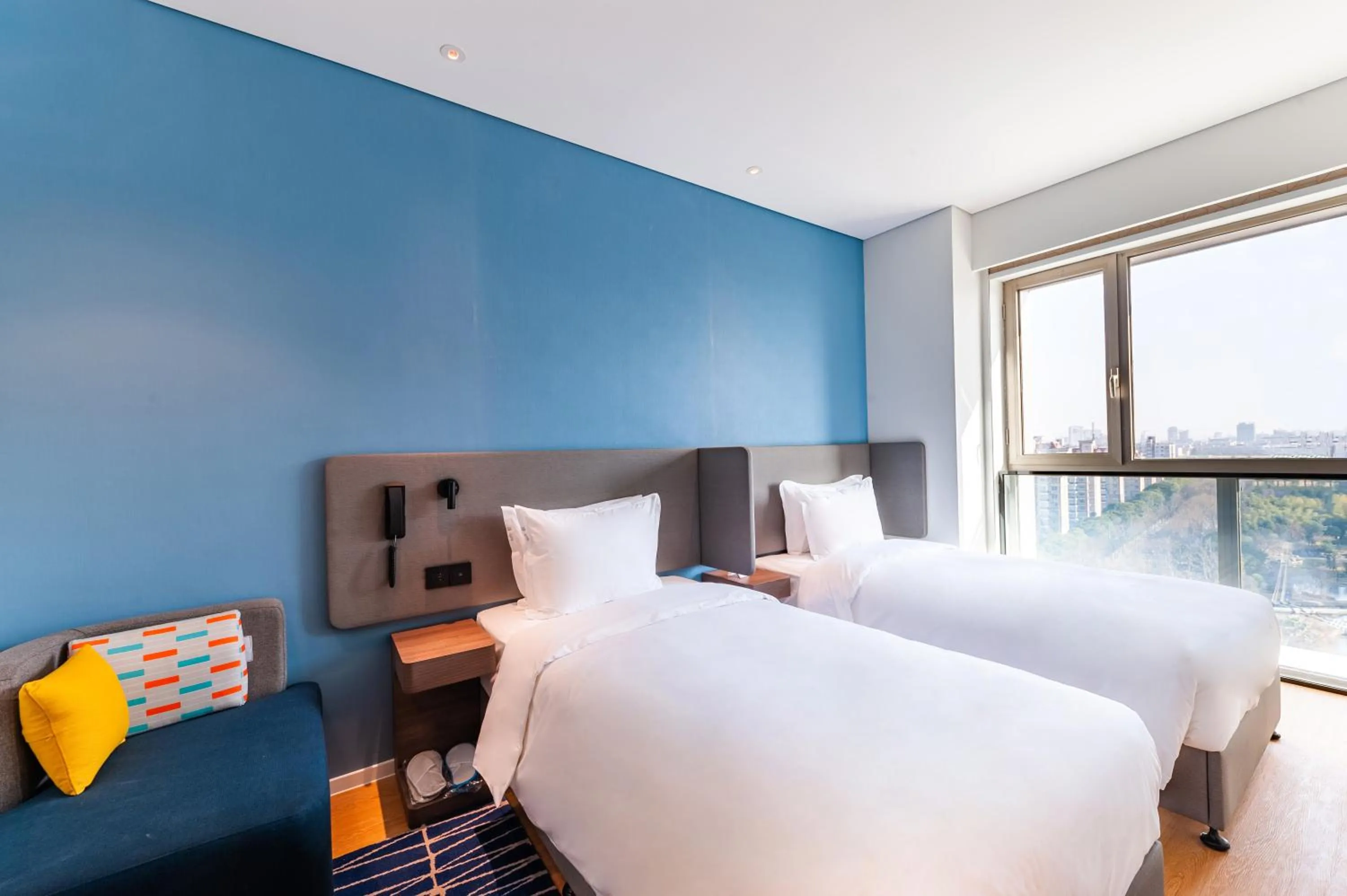 Bed in Holiday Inn Express Shanghai Baoyang by IHG