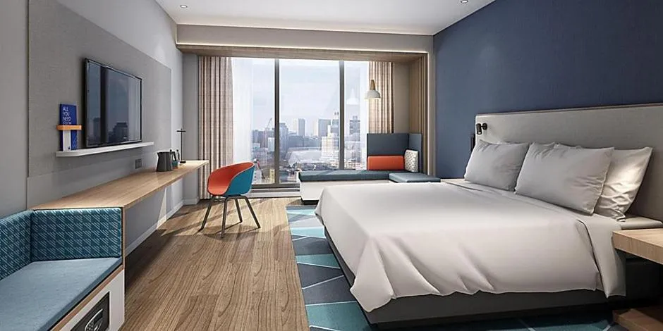 Bed in Holiday Inn Express Shanghai Baoyang by IHG