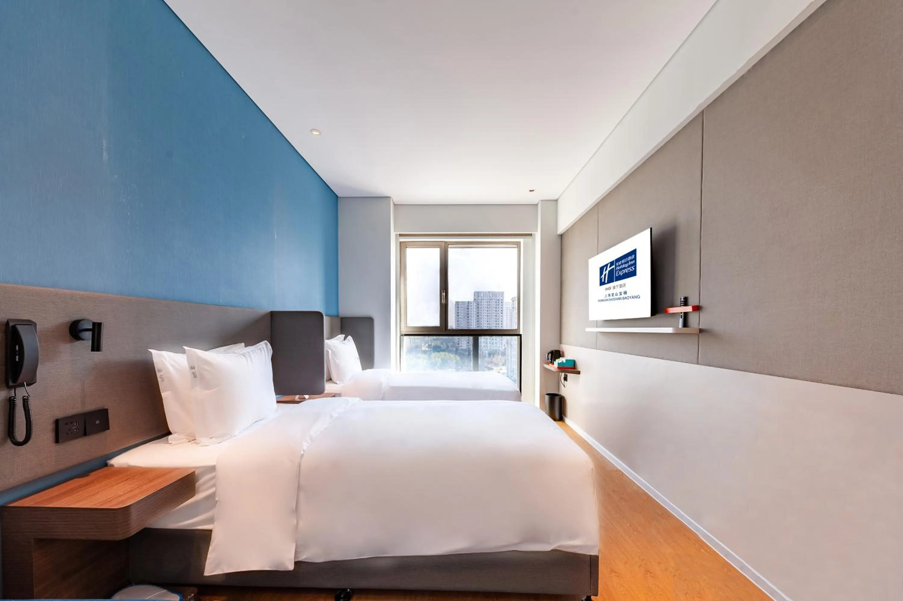 Bed in Holiday Inn Express Shanghai Baoyang by IHG