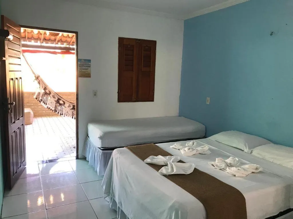 Bed in Pousada Numei de Jeri