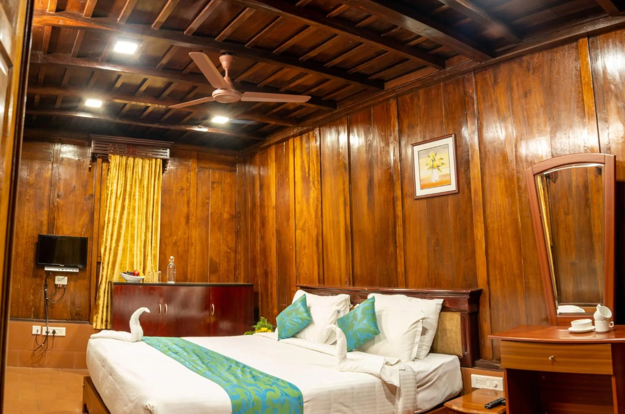 Bed in Kalpavanam Heritage Resort