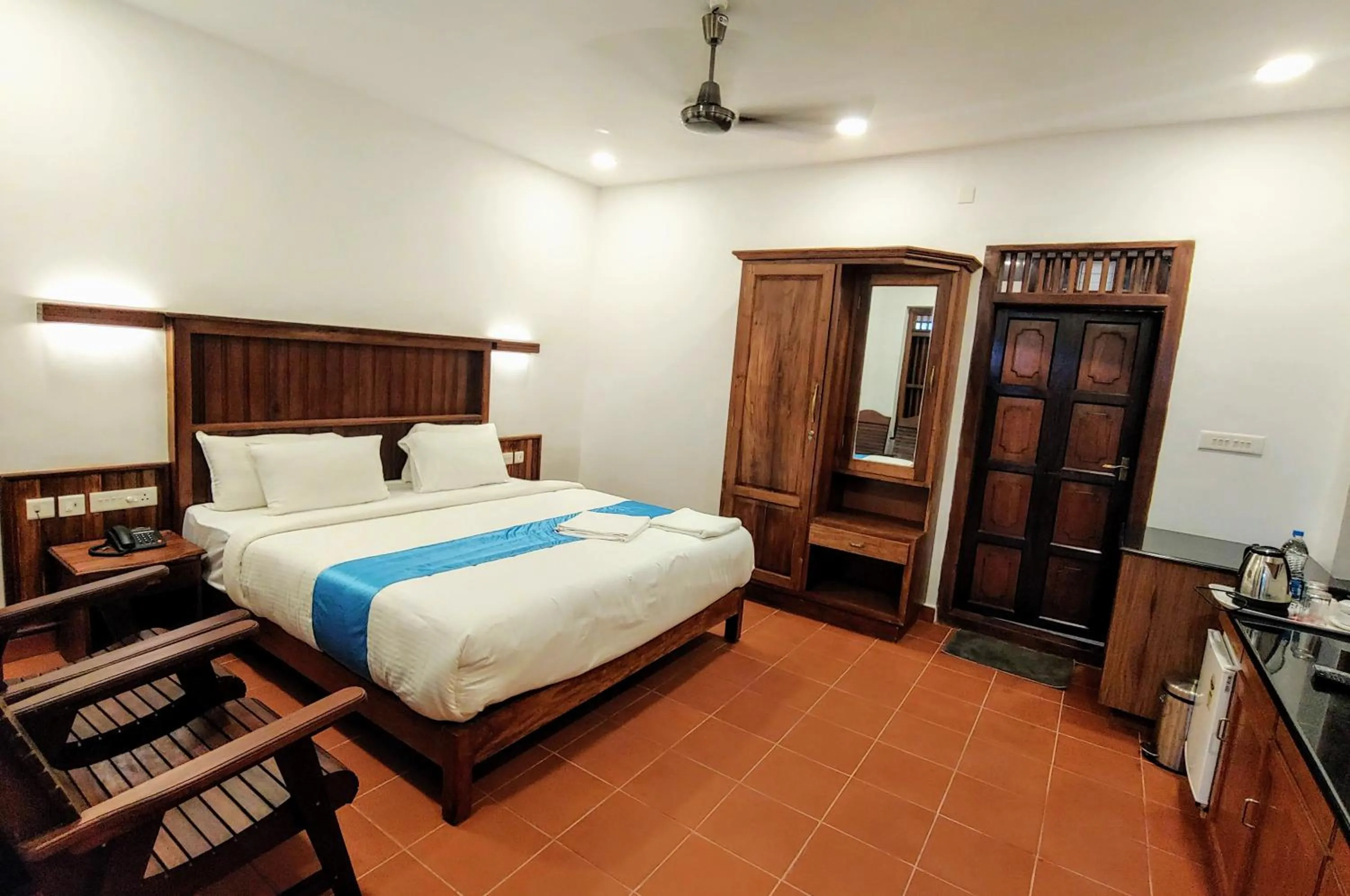 Bed in Kalpavanam Heritage Resort