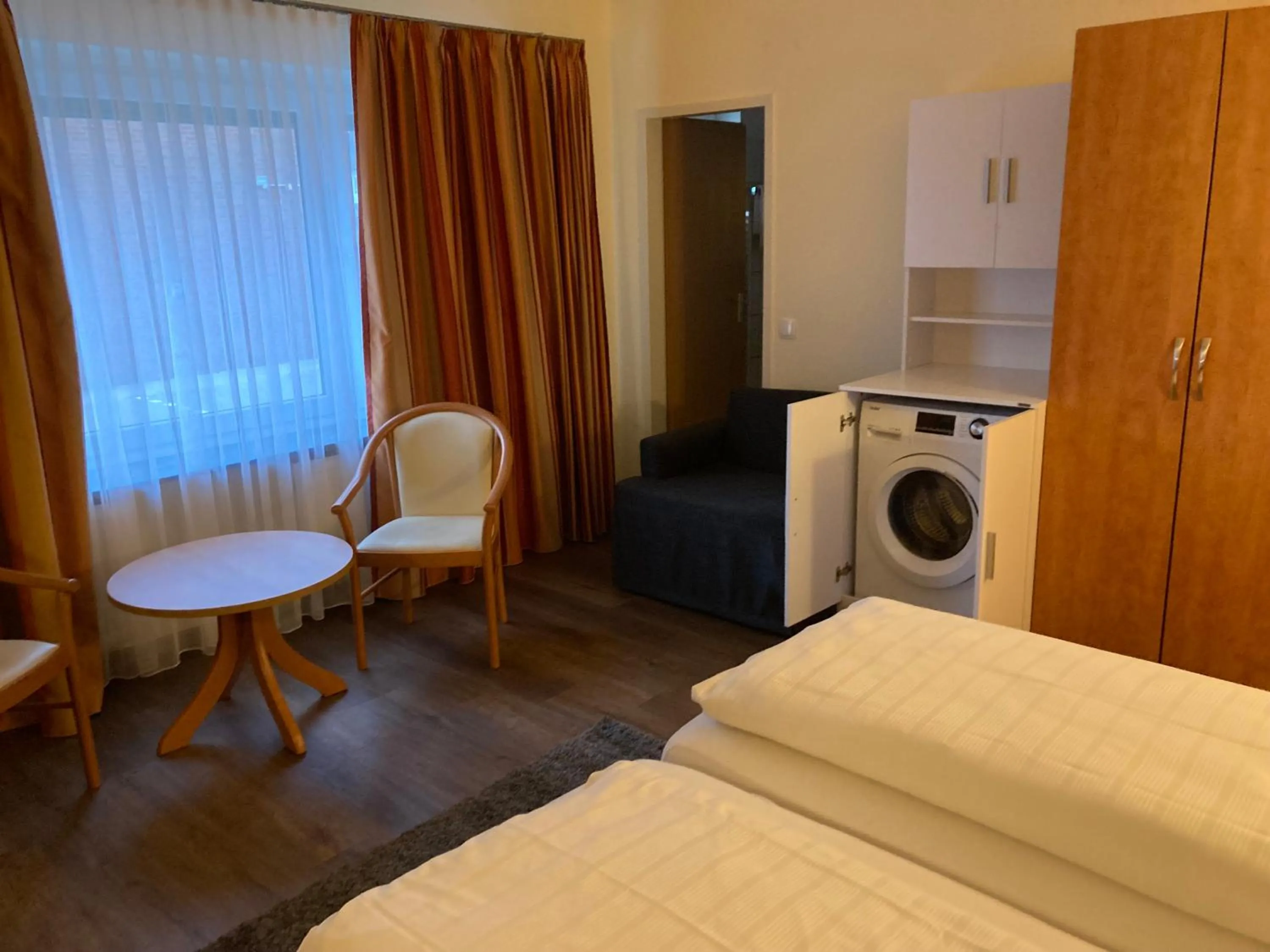 Seating area, Bed in Hotel Falk