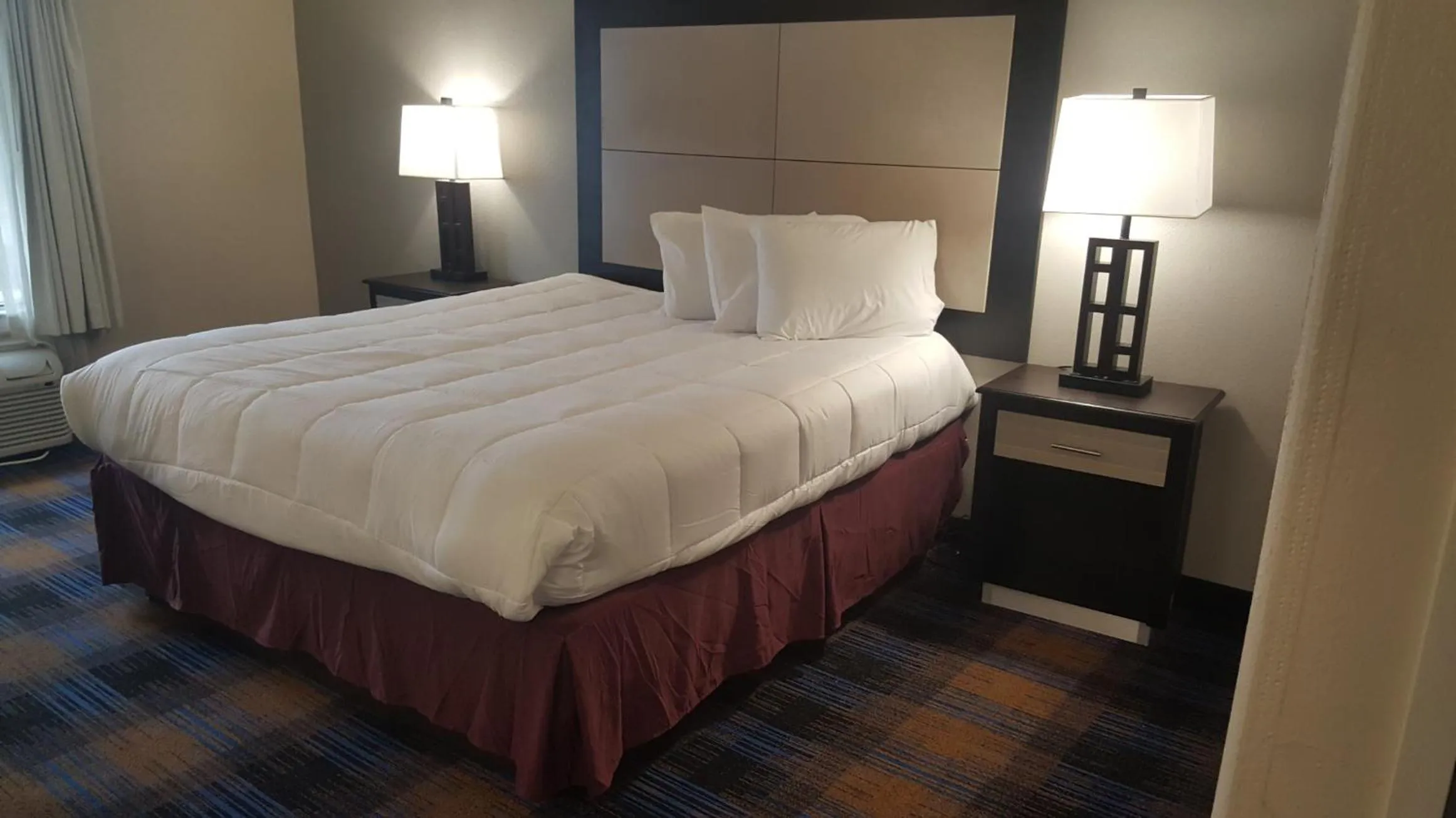 Bed in Baymont by Wyndham Pensacola