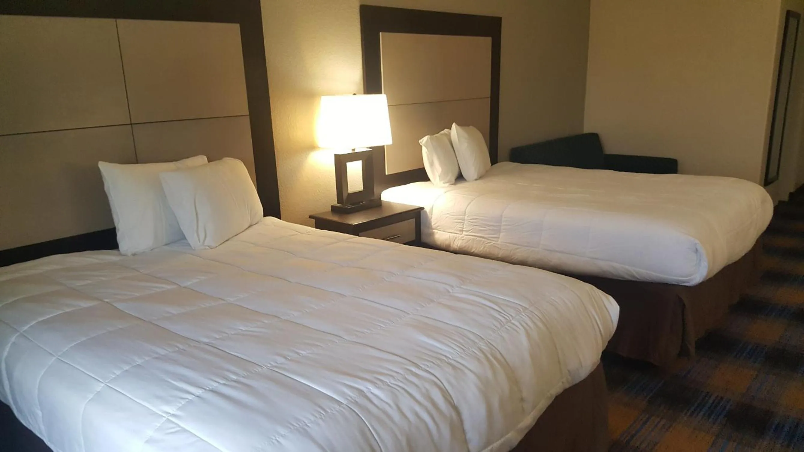 Bed in Baymont by Wyndham Pensacola