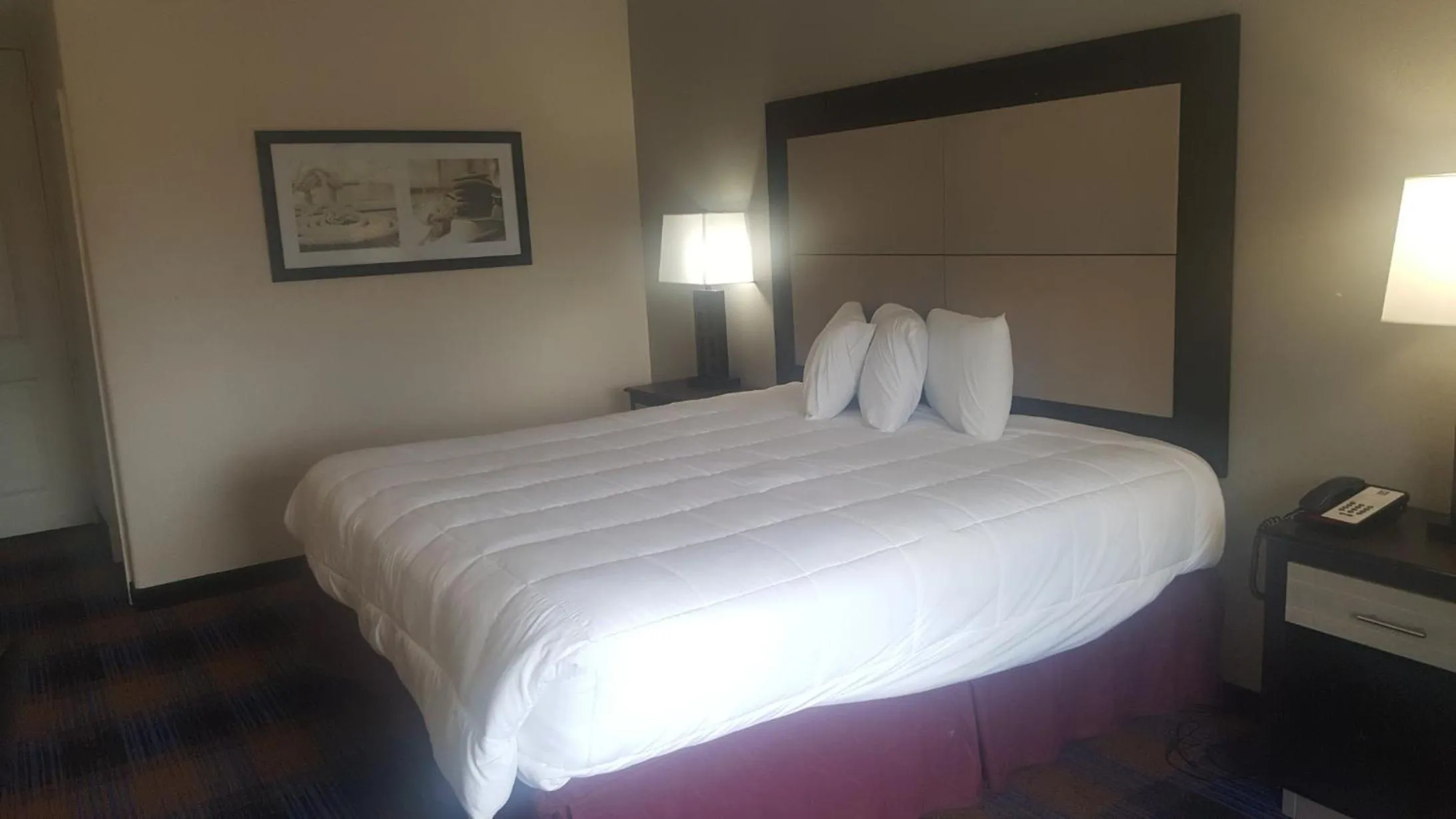 Bed in Baymont by Wyndham Pensacola