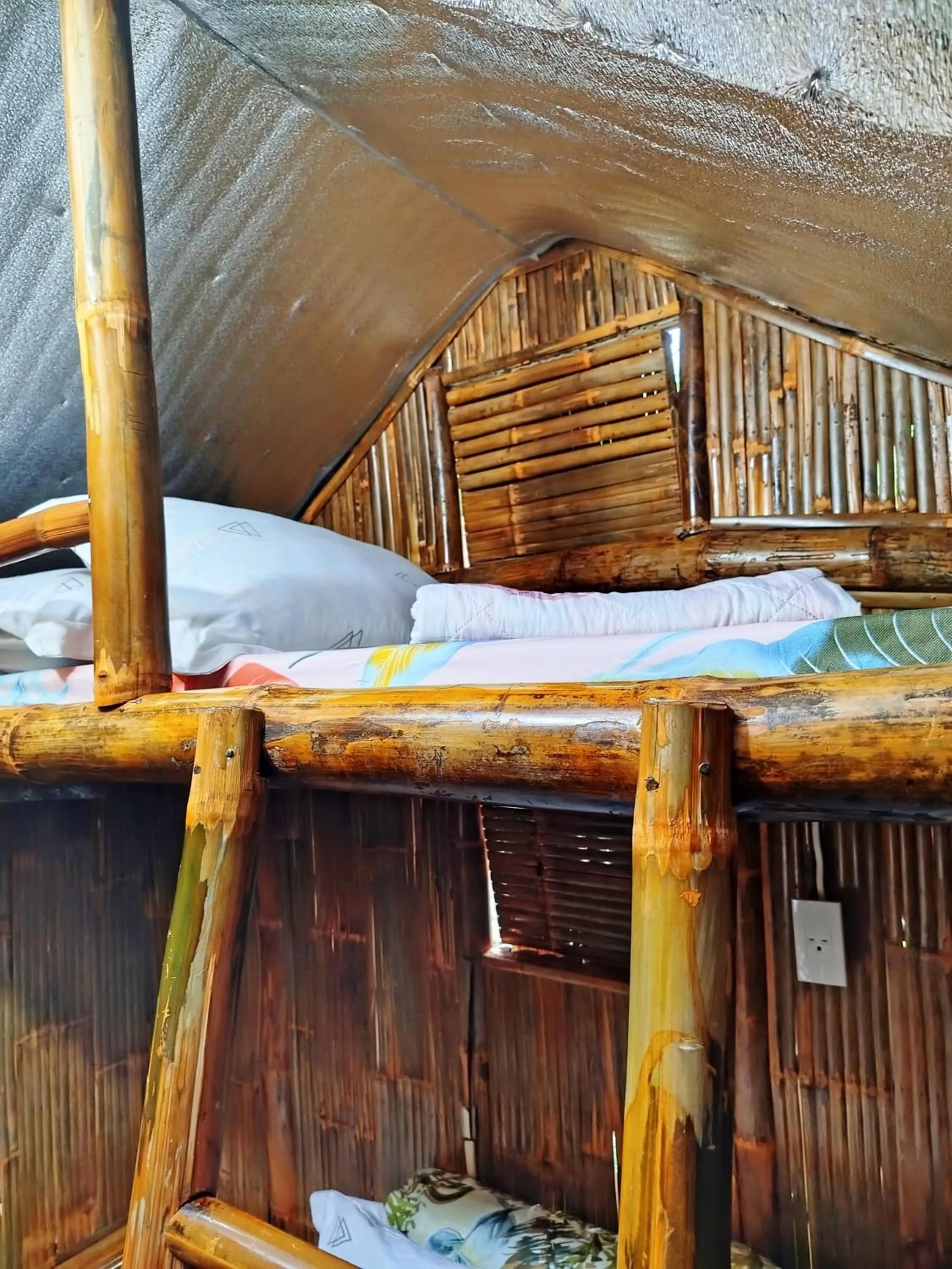 Bed in Rea's Bamboo Resort