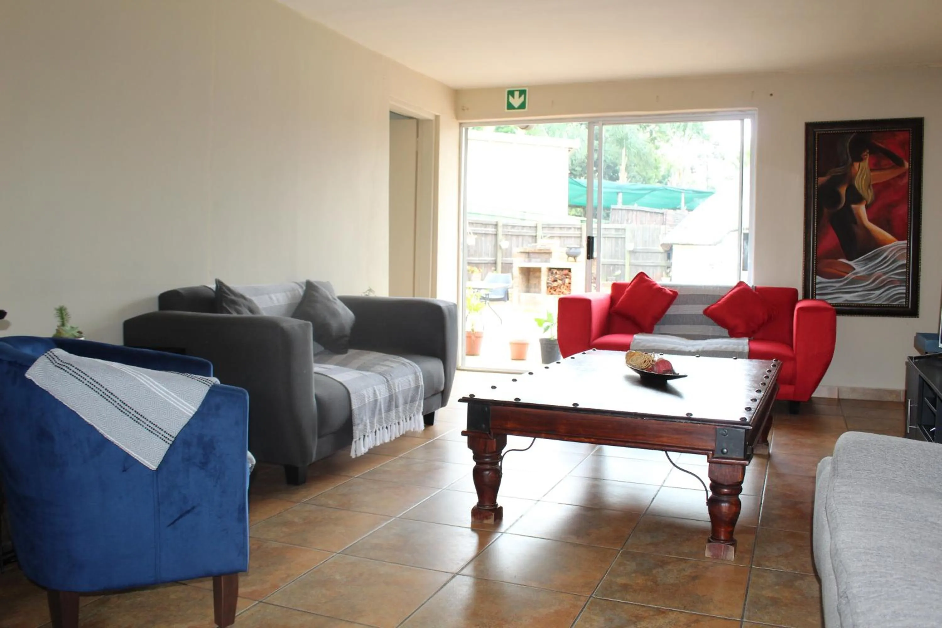 Communal lounge/ TV room in Reizigers Rusten