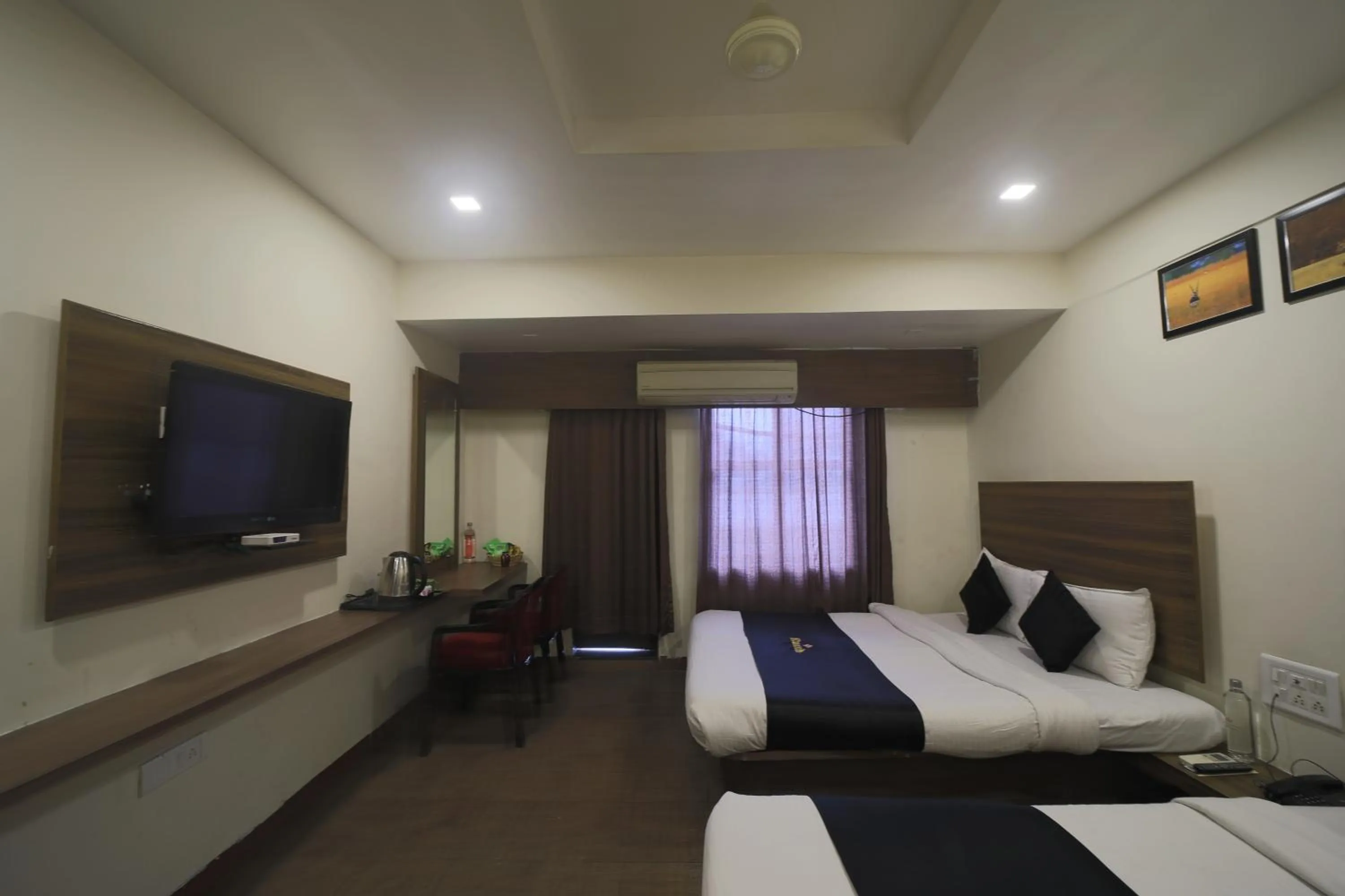 Property building, Bed in Saish Hotel Shirdi