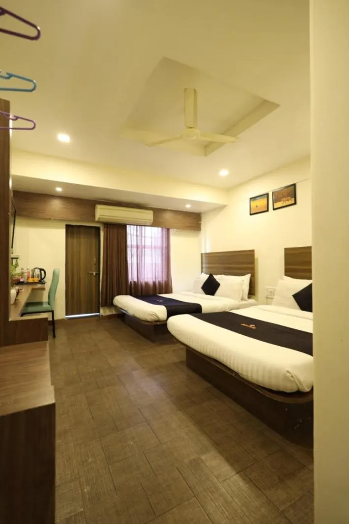Bedroom, Bed in Saish Hotel Shirdi