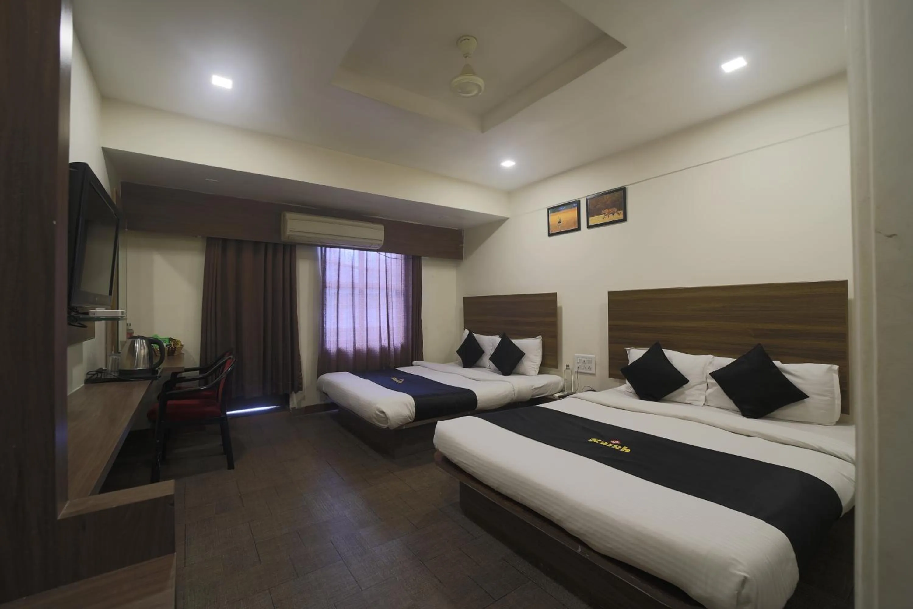 Property building, Bed in Saish Hotel Shirdi