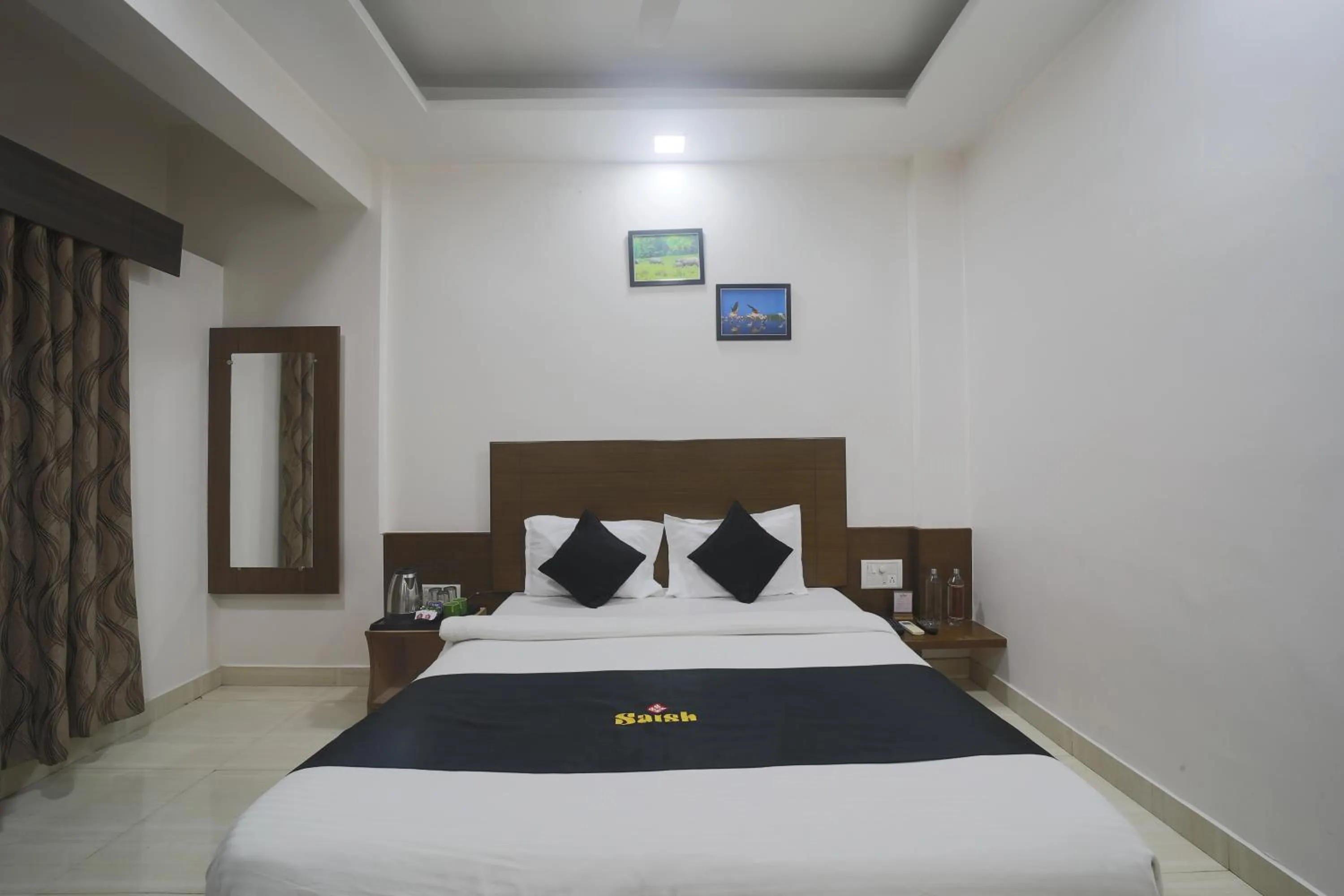 Property building, Bed in Saish Hotel Shirdi