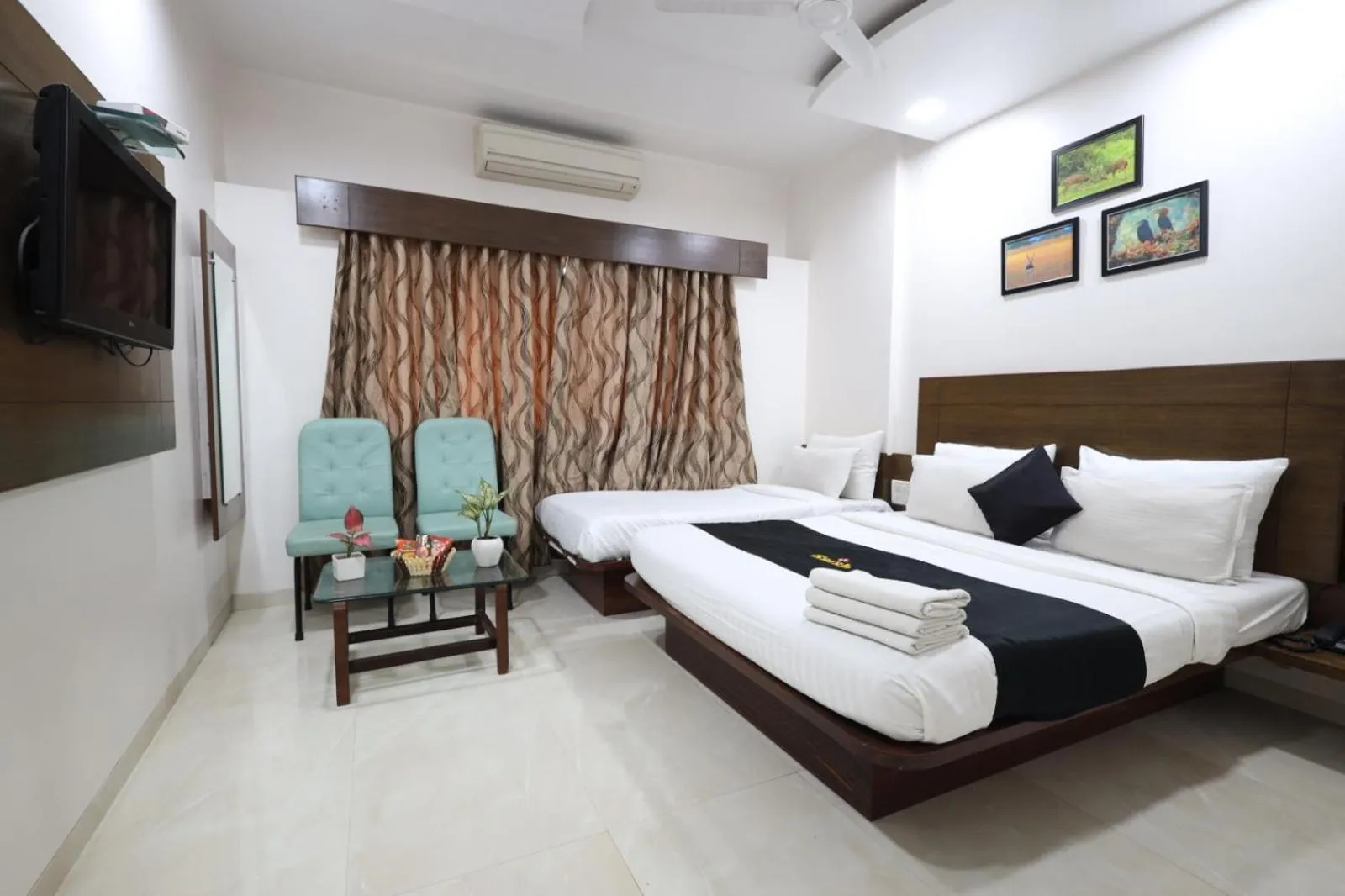 Photo of the whole room, Bed in Saish Hotel Shirdi