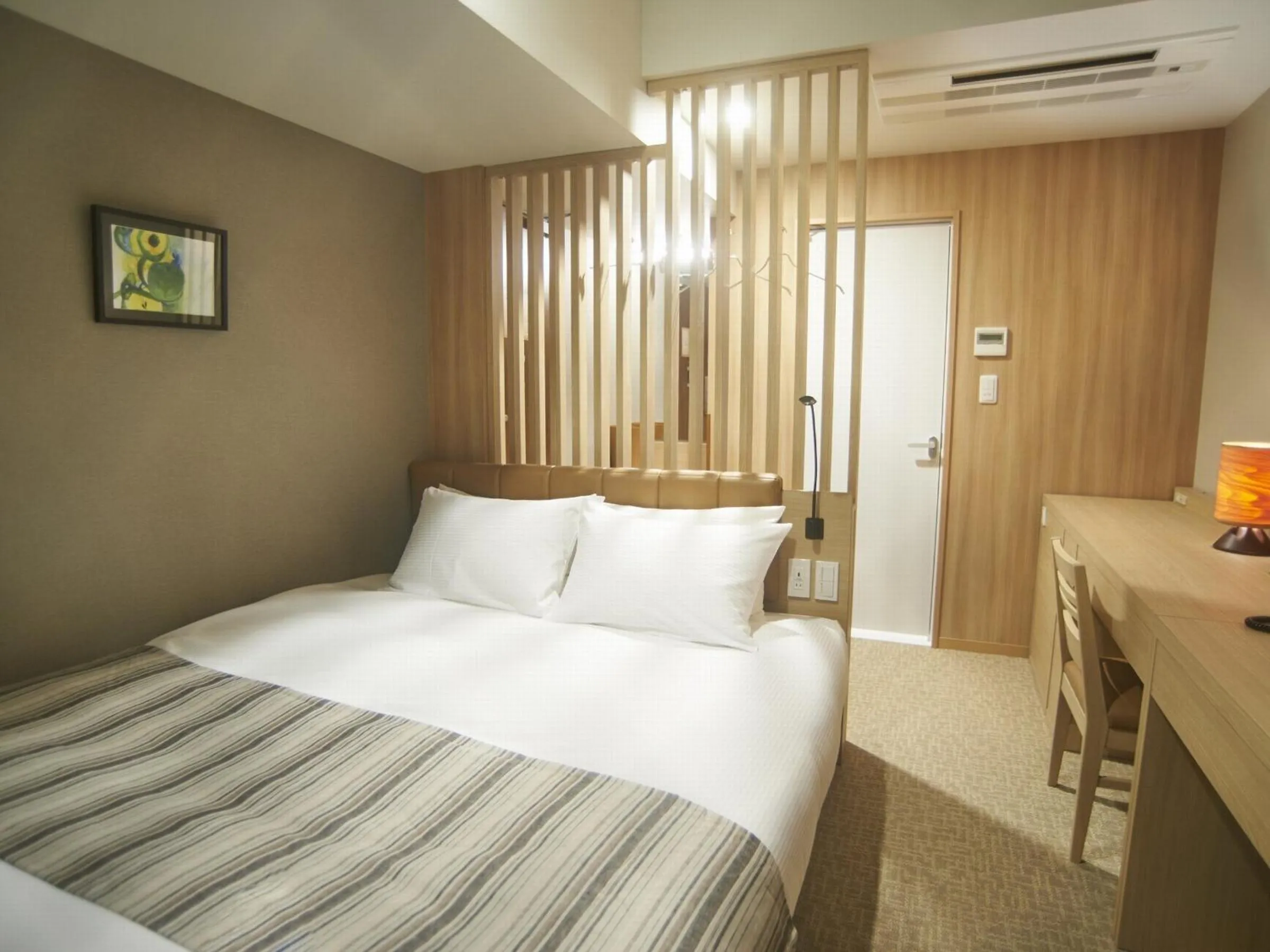 Bed in QuintessaHotel TokyoHaneda Comic&Books