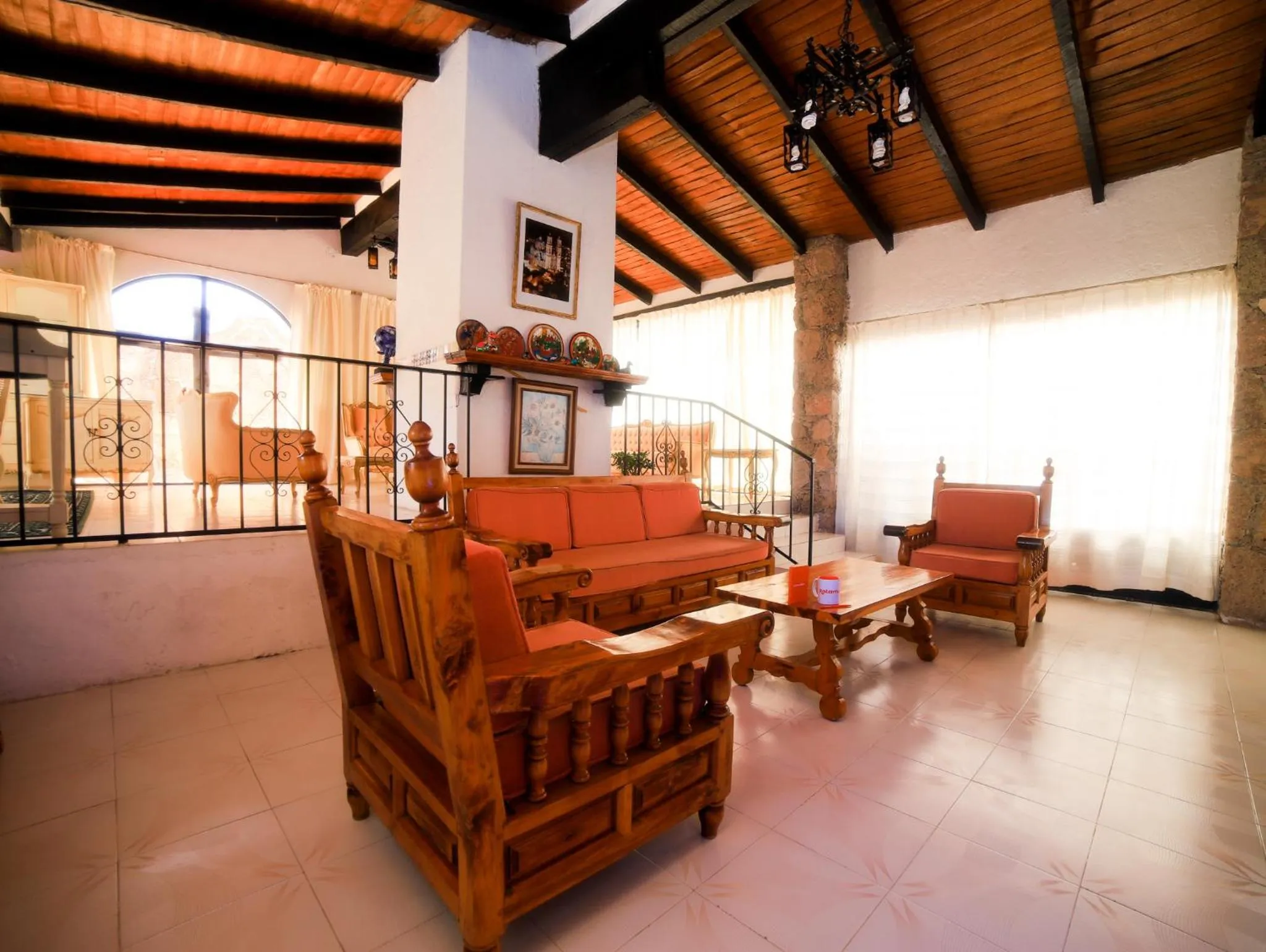 Communal lounge/ TV room in Casa de las Cruces Taxco