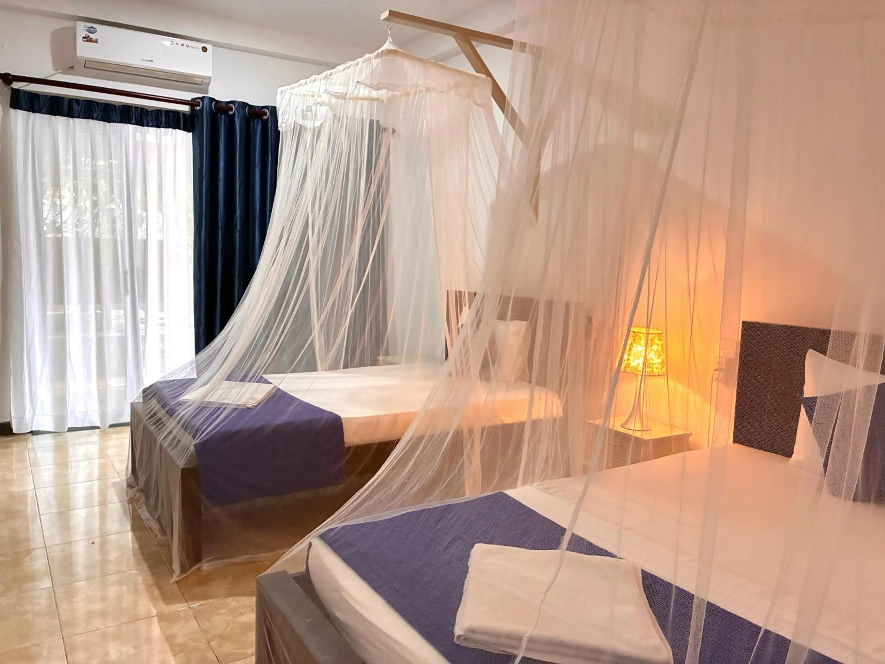 Bed in Mirissa Blue Whale Holiday Hotel