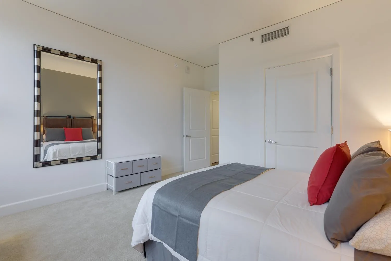 Bed in Renu Suites at The Burlington Portland