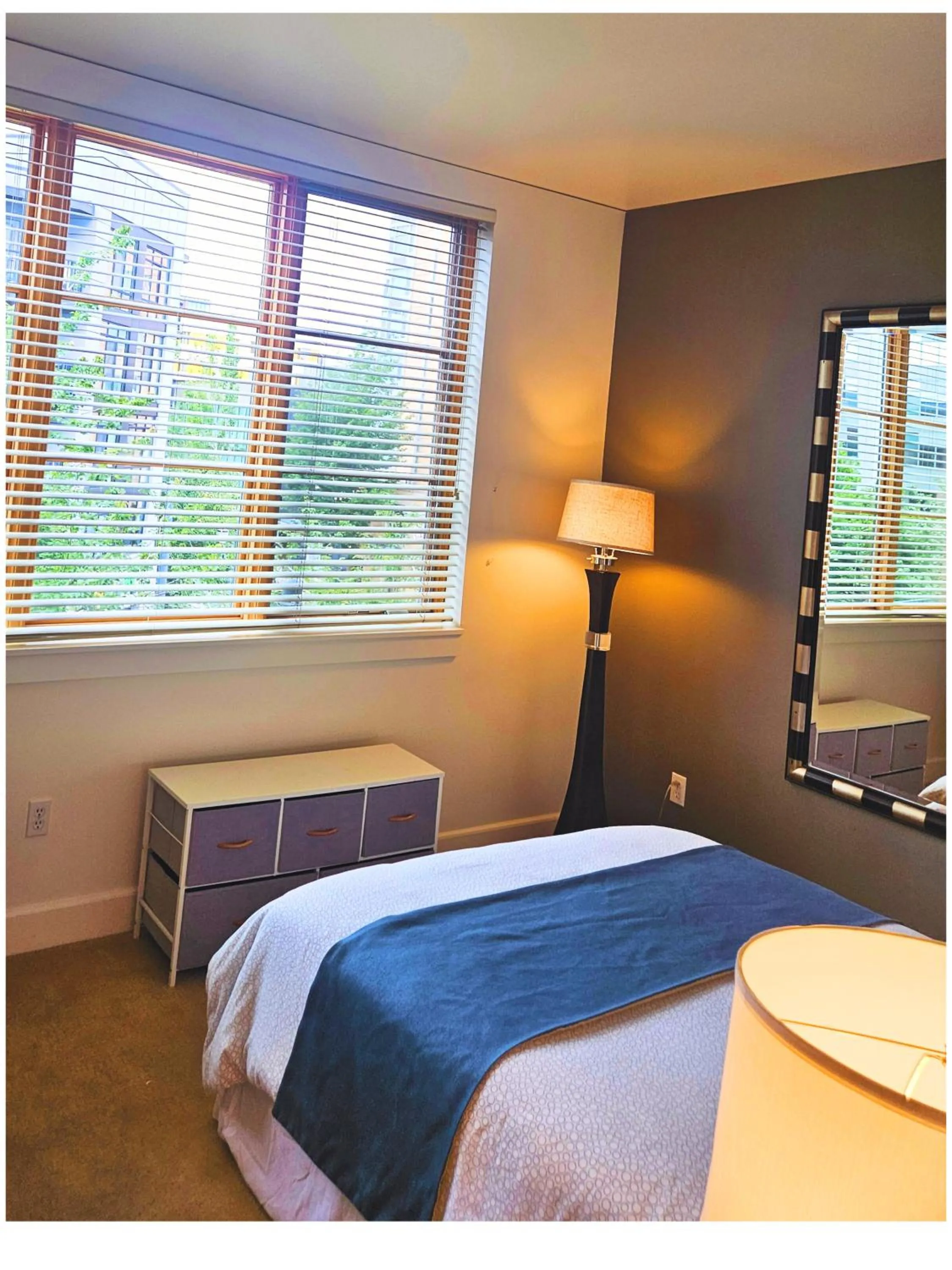 Bed in Renu Suites at The Burlington Portland