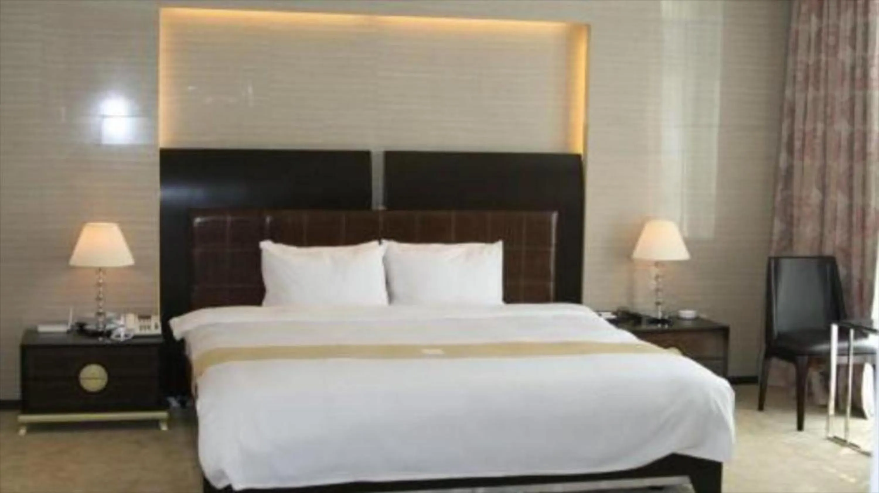 Bed in Ecograd Hotel