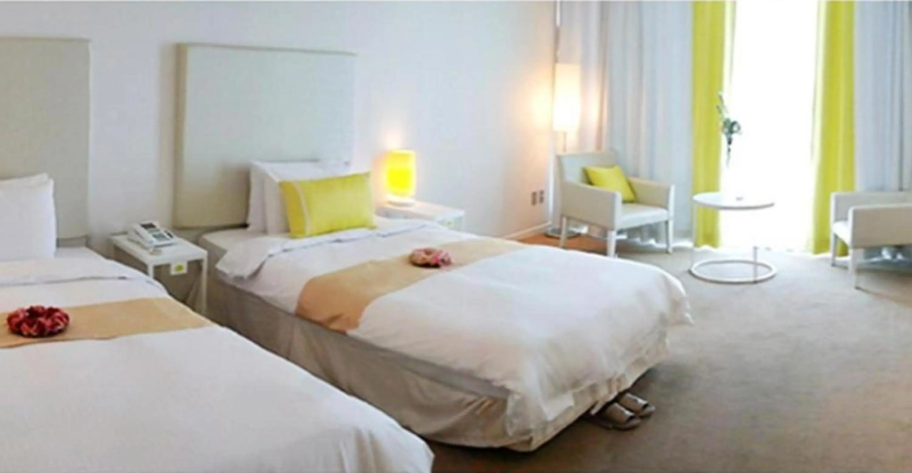 Bed in Ecograd Hotel