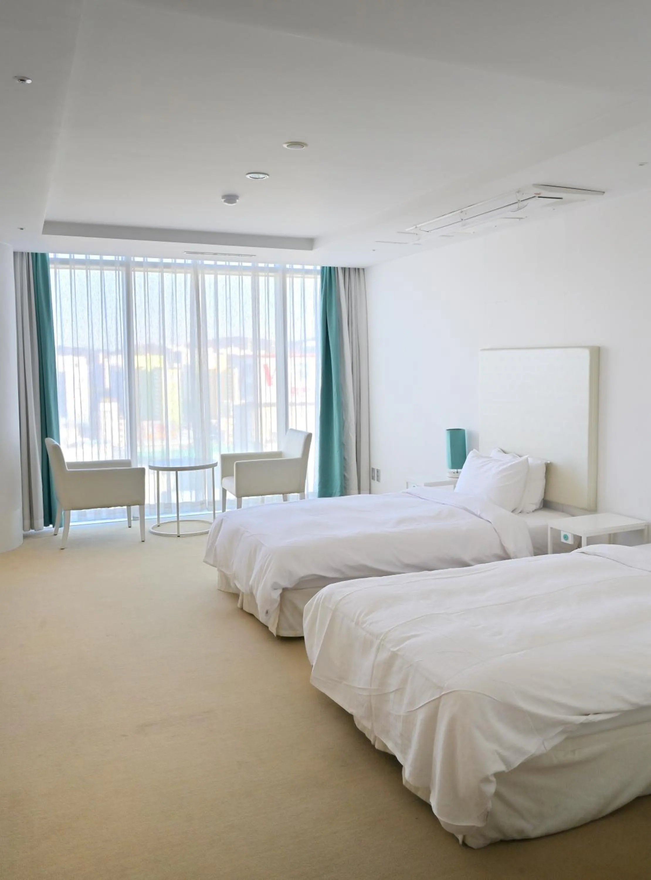 Bed in Ecograd Hotel