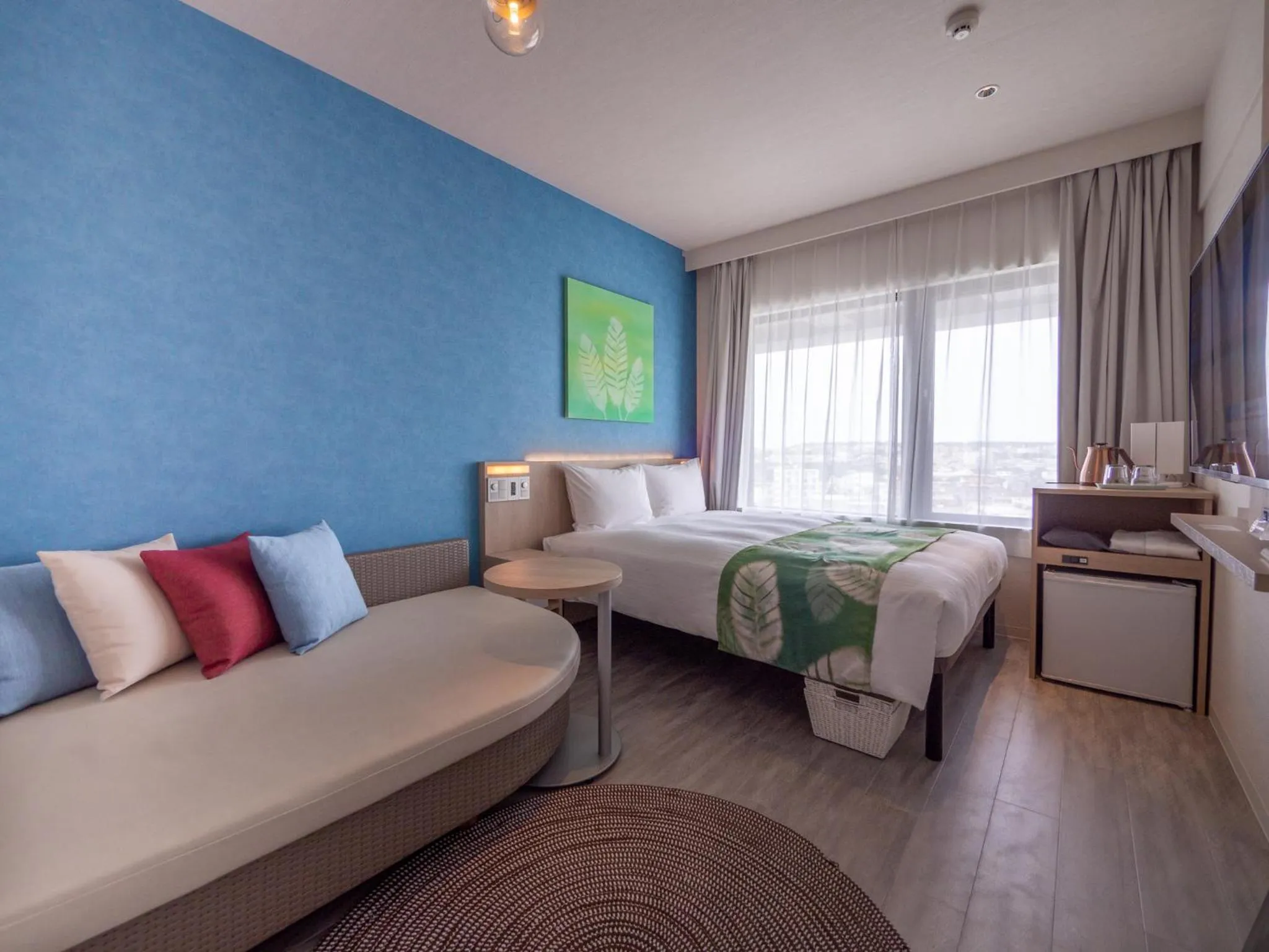 Photo of the whole room, Bed in Tabino Hotel lit Miyakojima