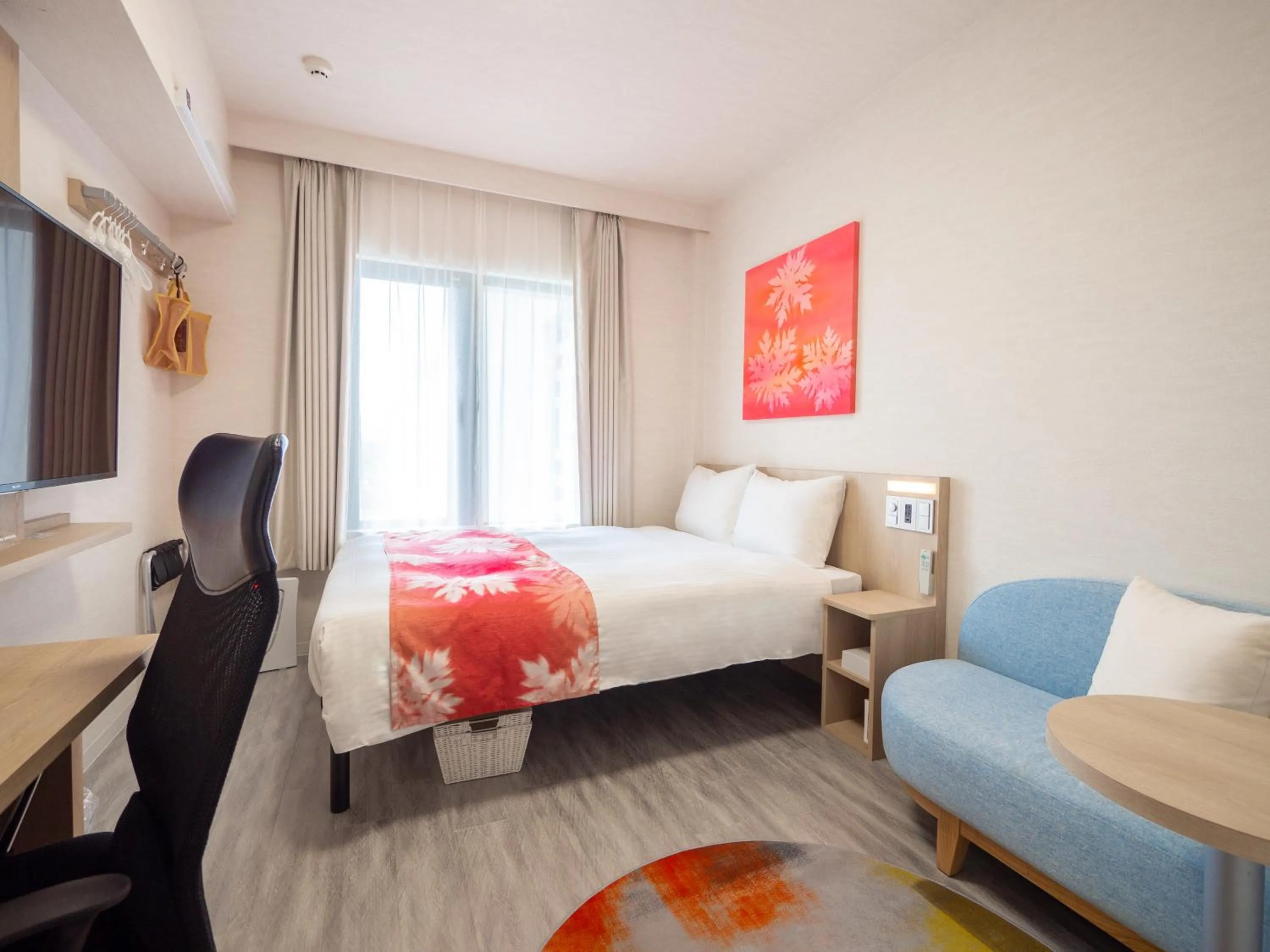 Photo of the whole room, Bed in Tabino Hotel lit Miyakojima