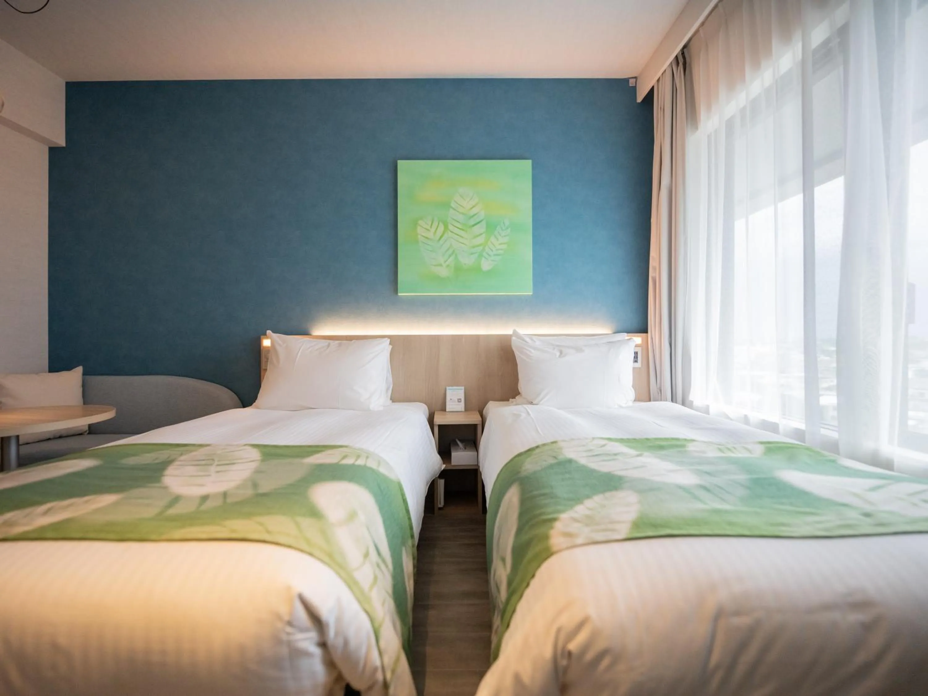 Photo of the whole room, Bed in Tabino Hotel lit Miyakojima