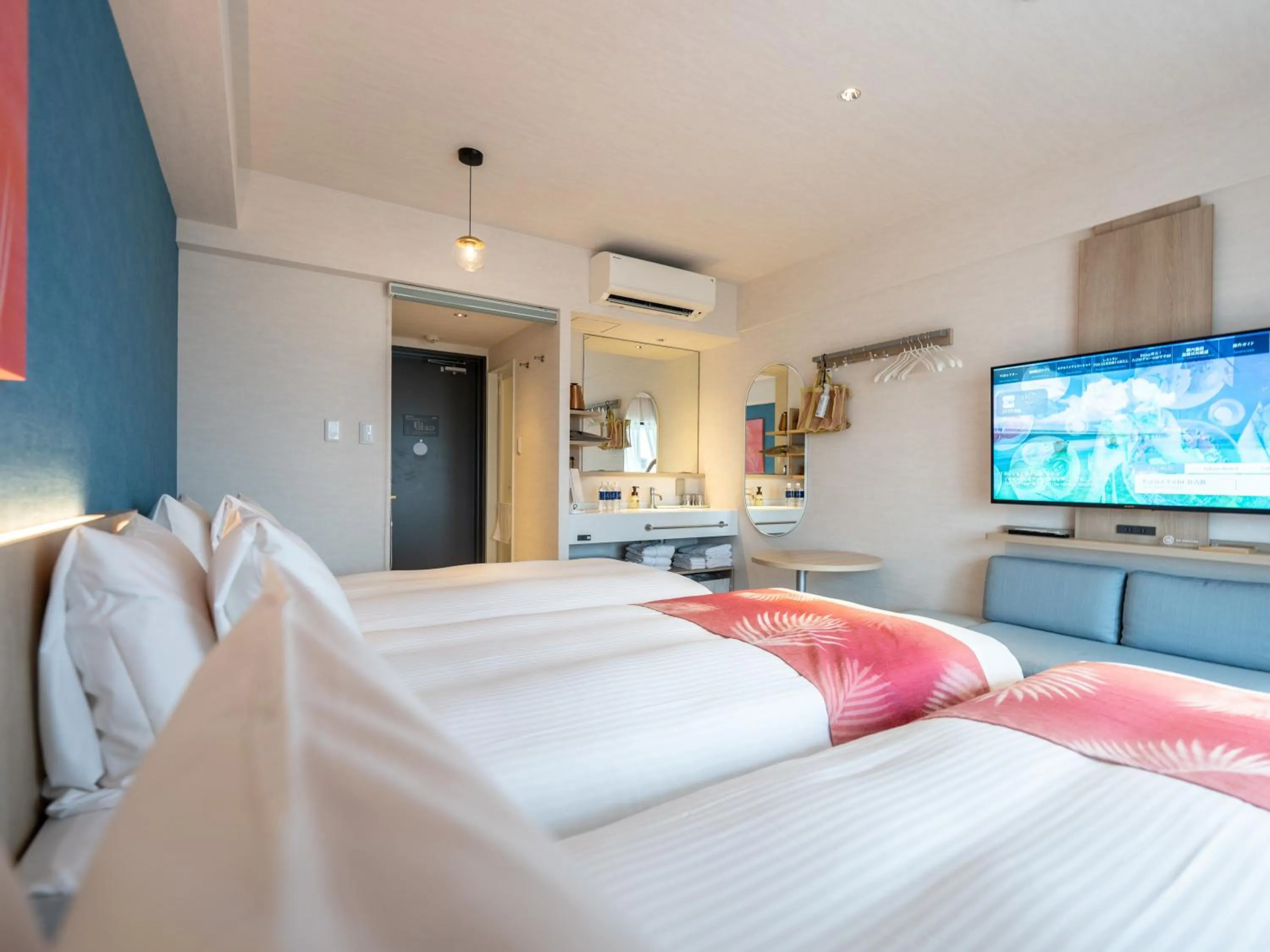 Photo of the whole room, Bed in Tabino Hotel lit Miyakojima