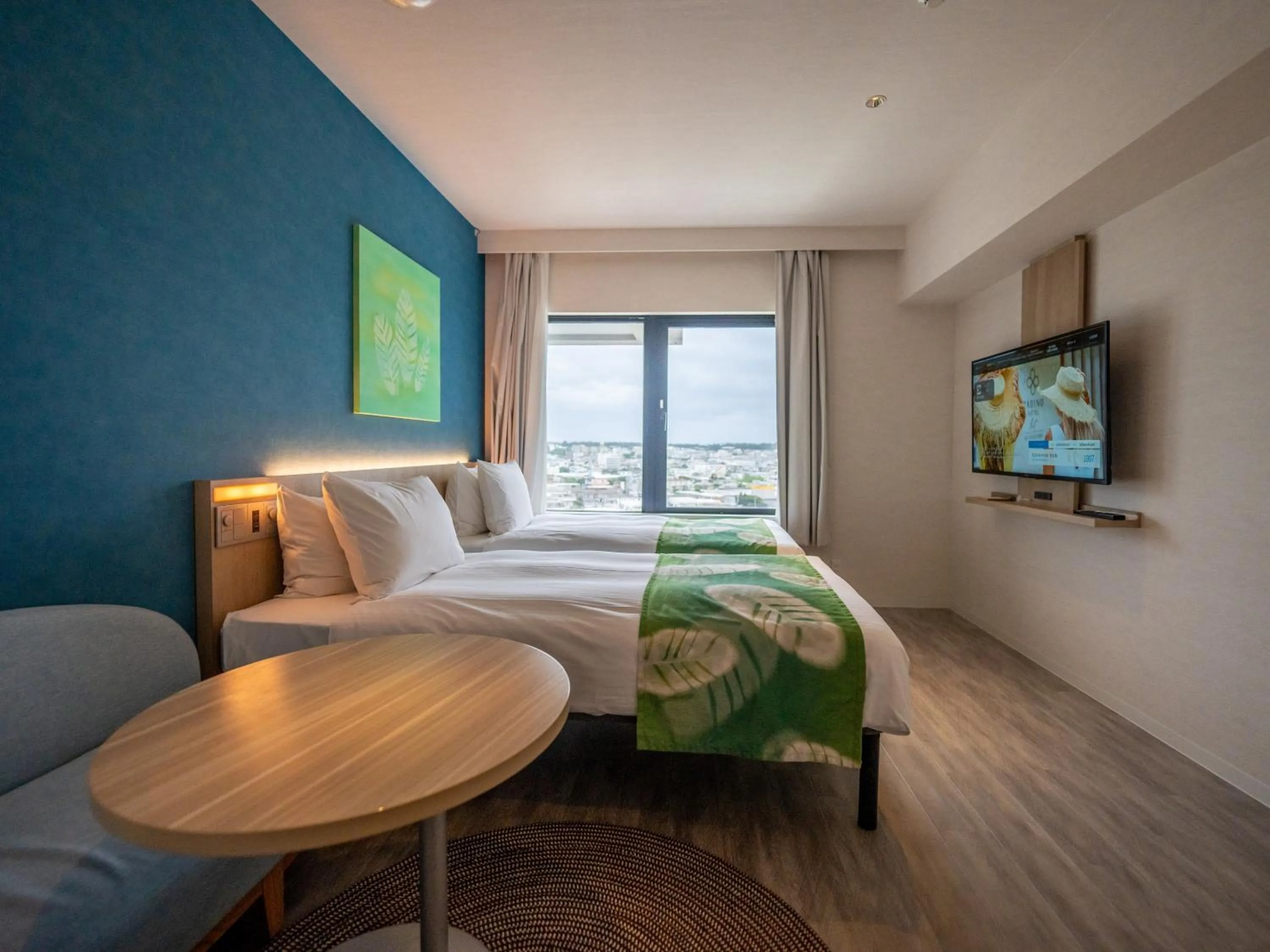 Photo of the whole room, Bed in Tabino Hotel lit Miyakojima