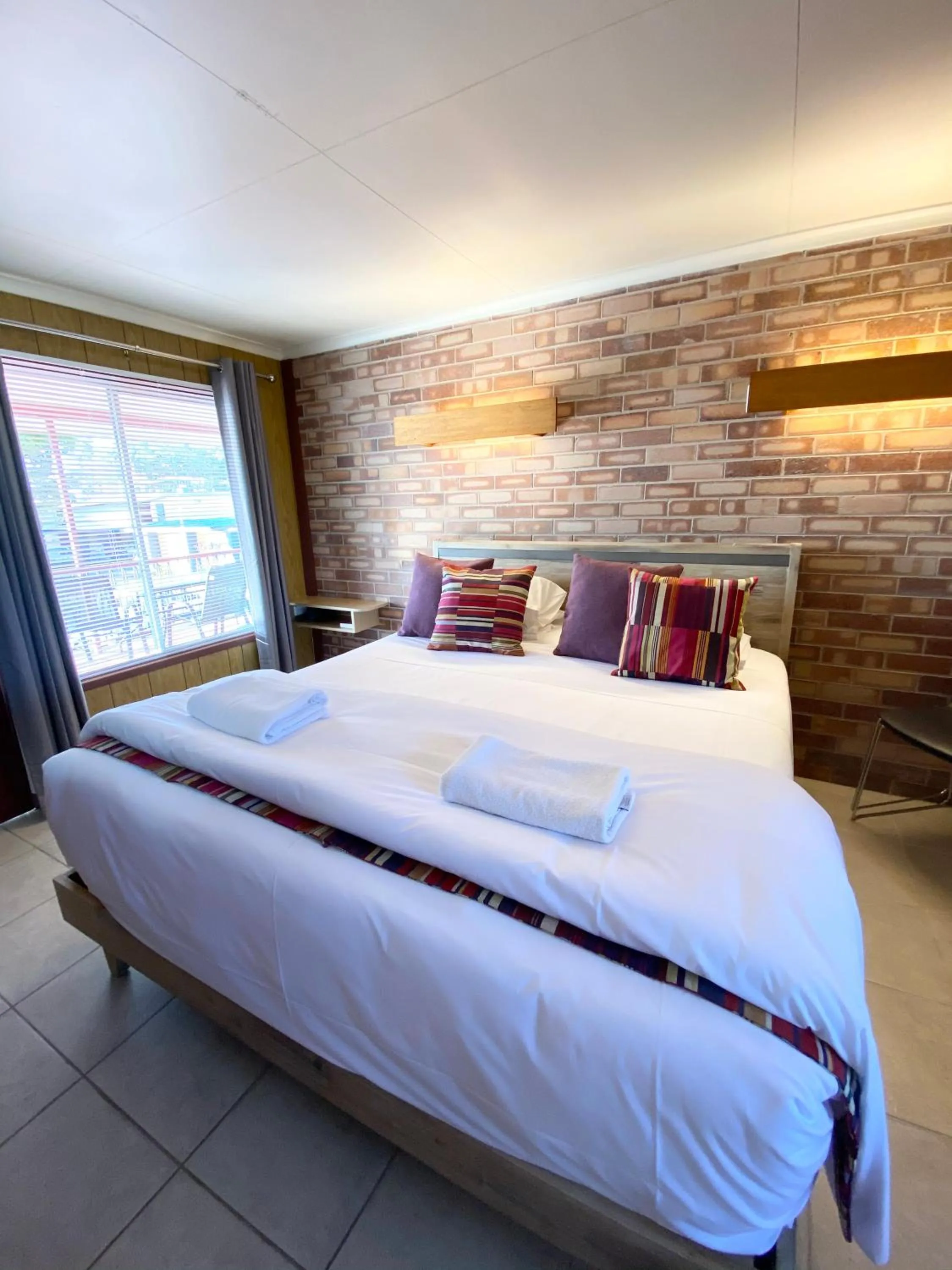 Bed in PROSERPINE MOTOR LODGE