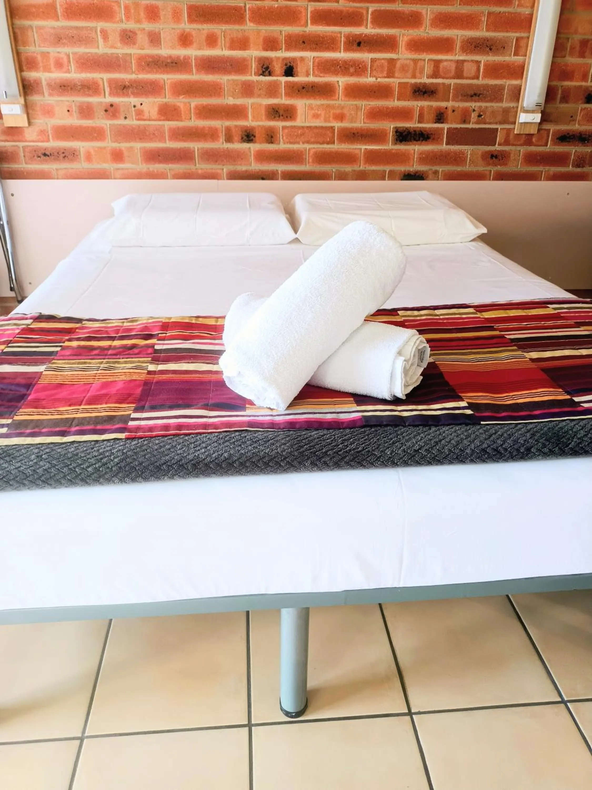 Bed in PROSERPINE MOTOR LODGE