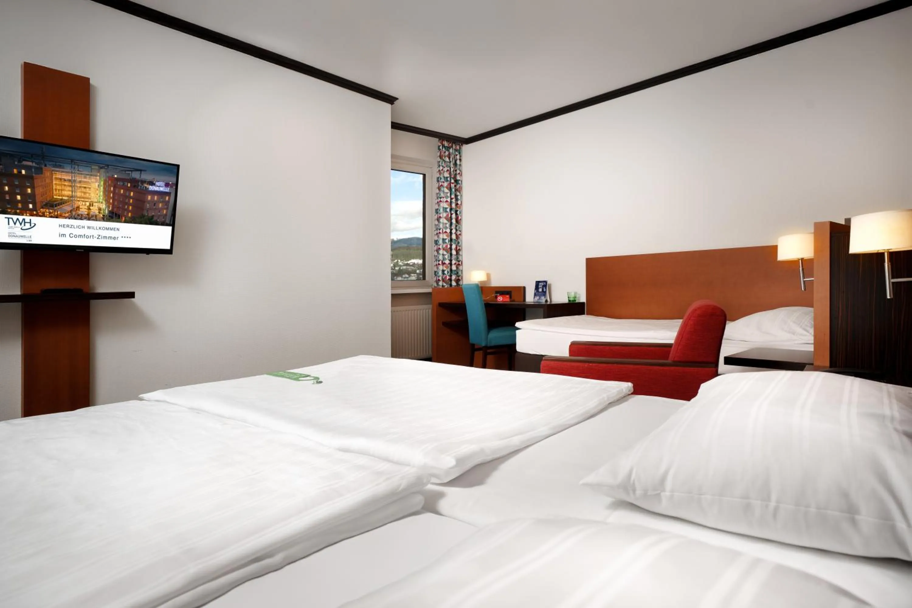 Bed in Trans World Hotel Donauwelle