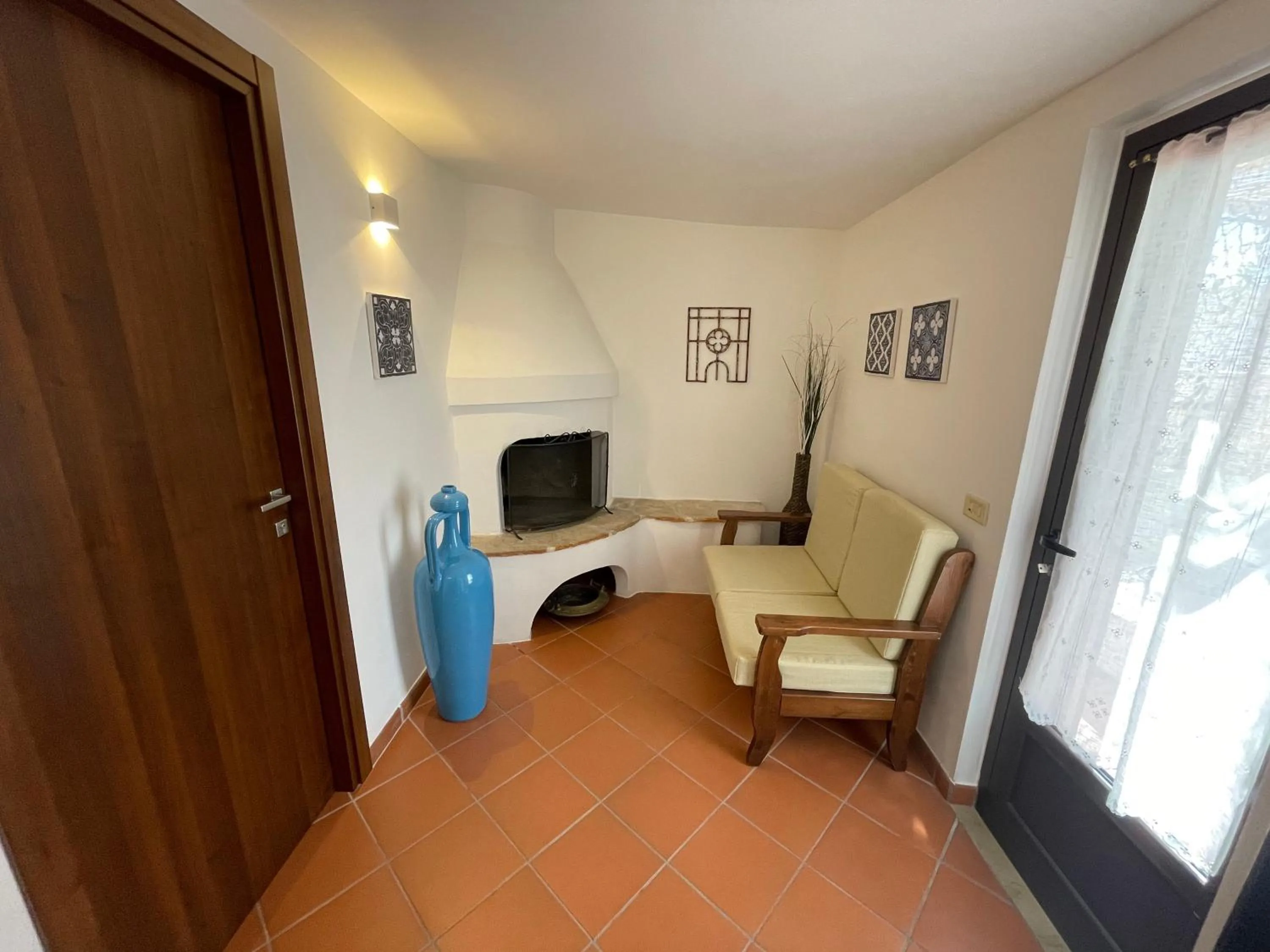 Communal lounge/ TV room in Dimora Bellini Apartment and Rooms
