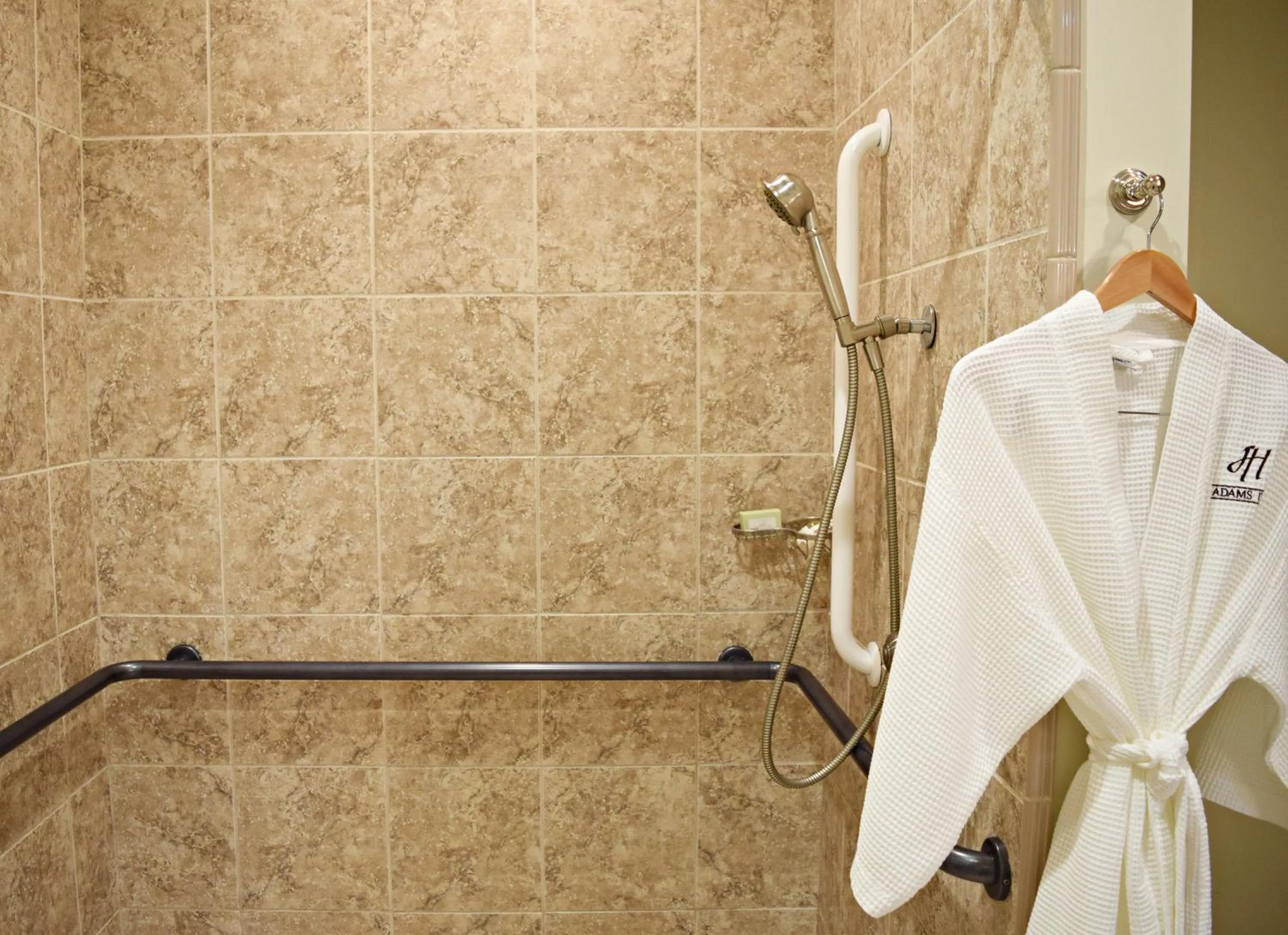 Shower in JH Adams Inn, Trademark Collection by Wyndham