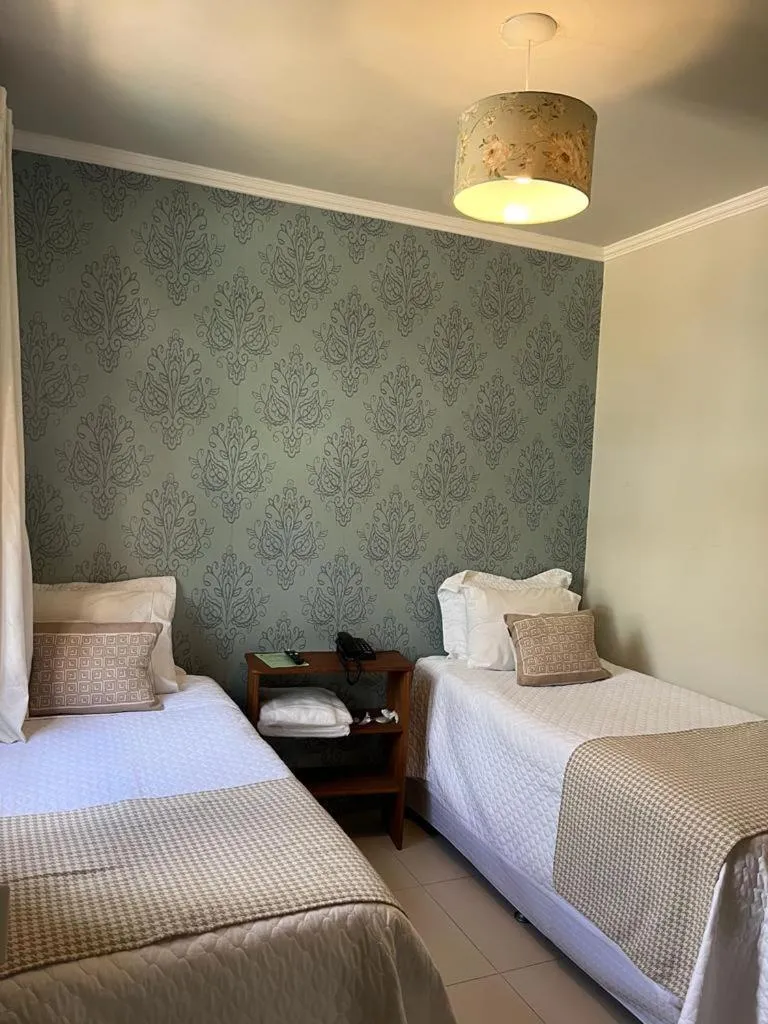 Bed in POUSADA CAPIM LIMÃO