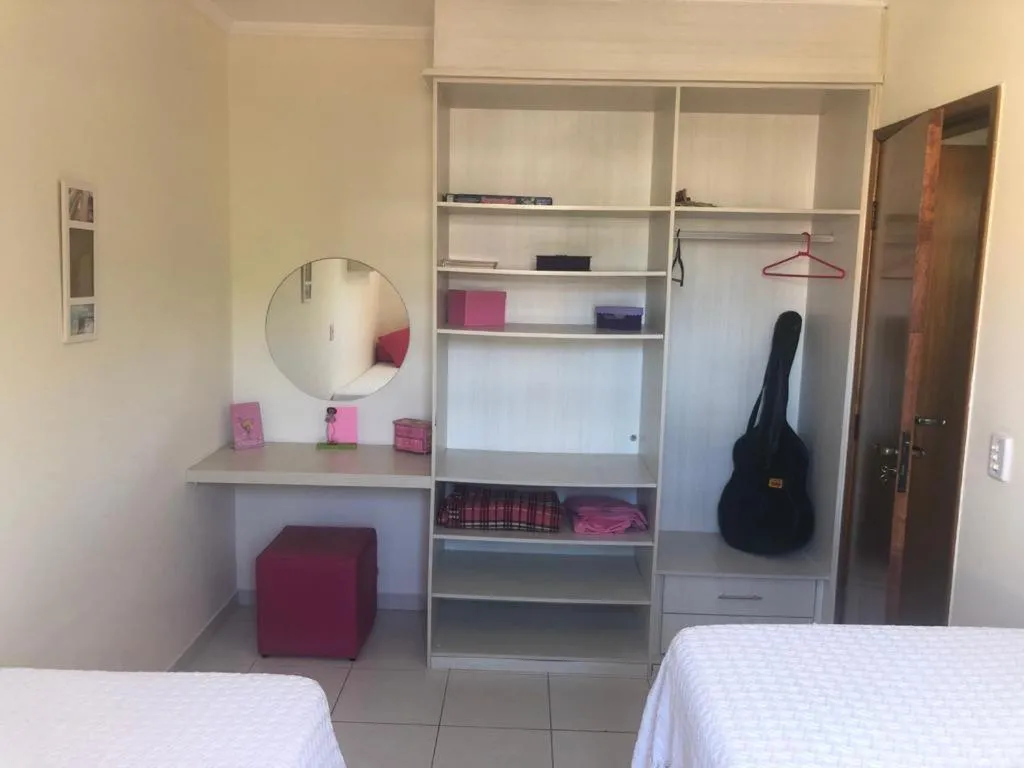 Bed in Apartamento área nobre da praia grande, vista para o mar, 3 suítes