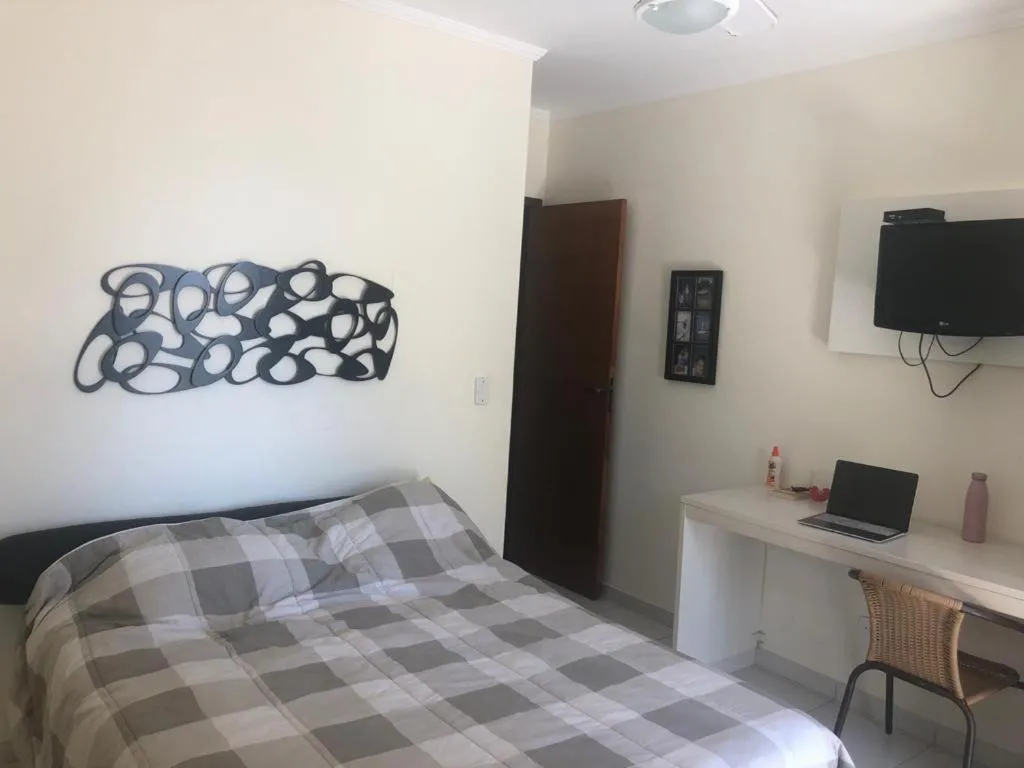 Bed in Apartamento área nobre da praia grande, vista para o mar, 3 suítes