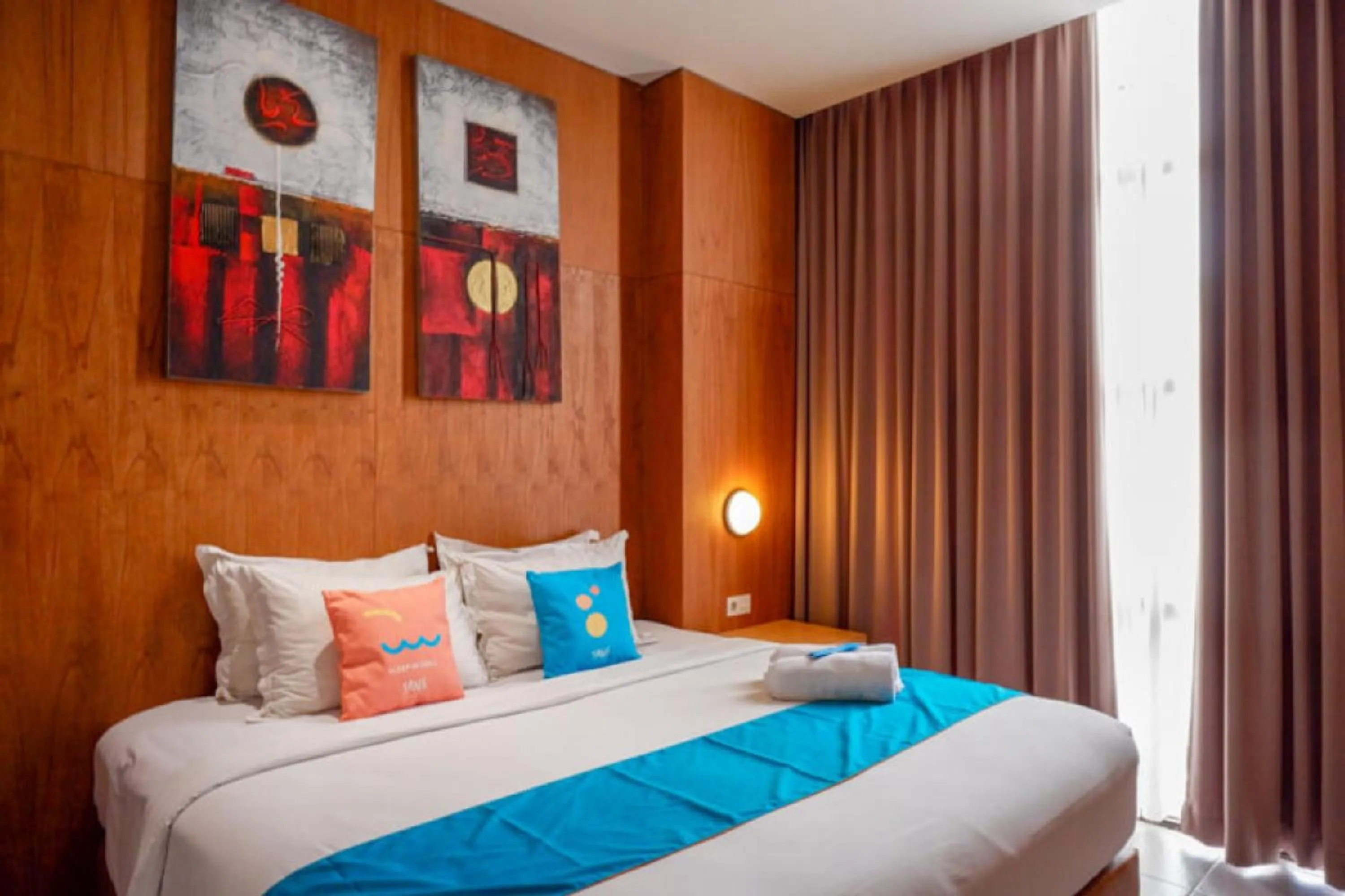 Bed in Sans Hotel Ekkon Yogyakarta by Reddoorz