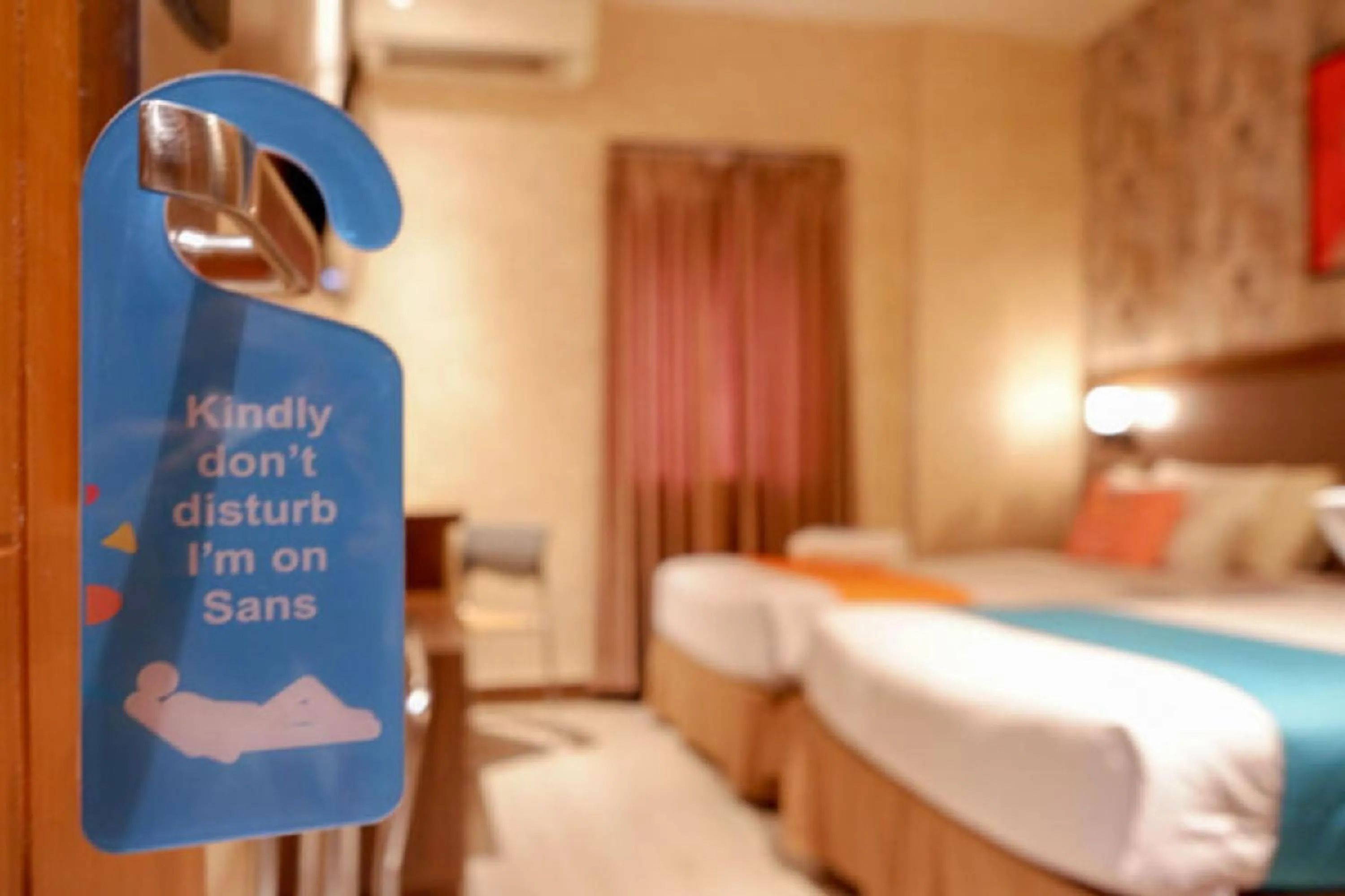 Bed in Sans Hotel Ekkon Yogyakarta by Reddoorz