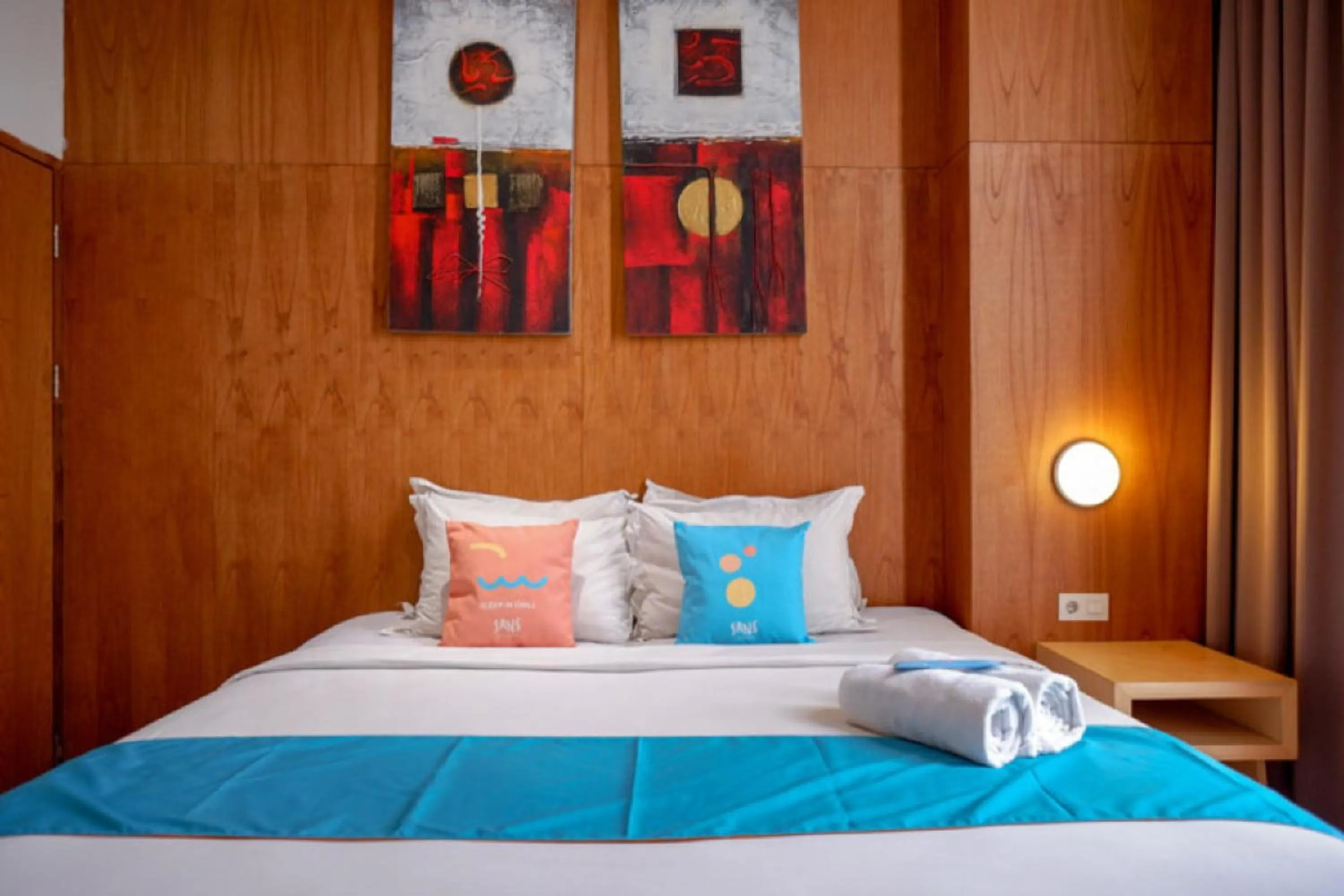 Bed in Sans Hotel Ekkon Yogyakarta by Reddoorz
