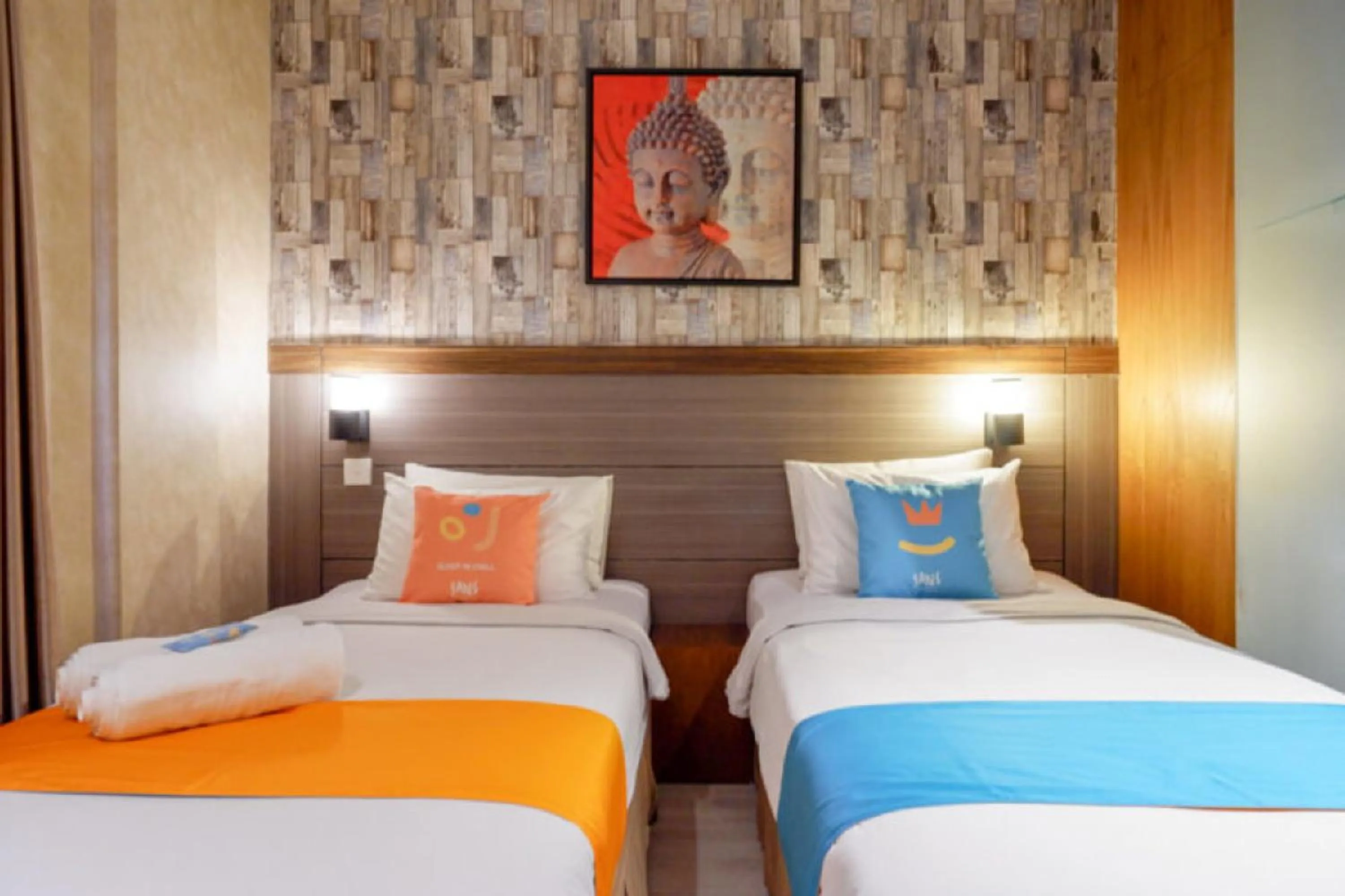 Bed in Sans Hotel Ekkon Yogyakarta by Reddoorz