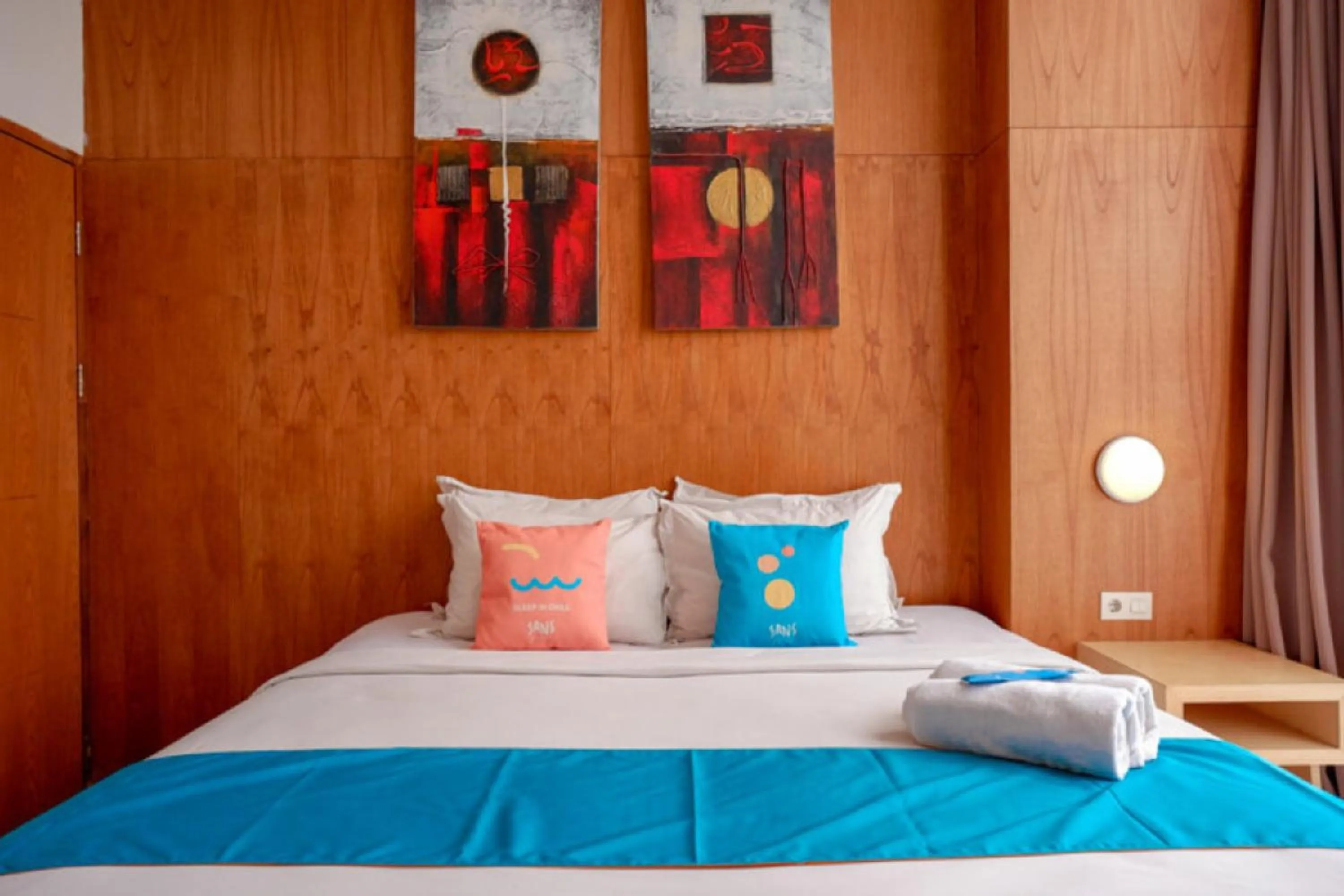 Bed in Sans Hotel Ekkon Yogyakarta by Reddoorz