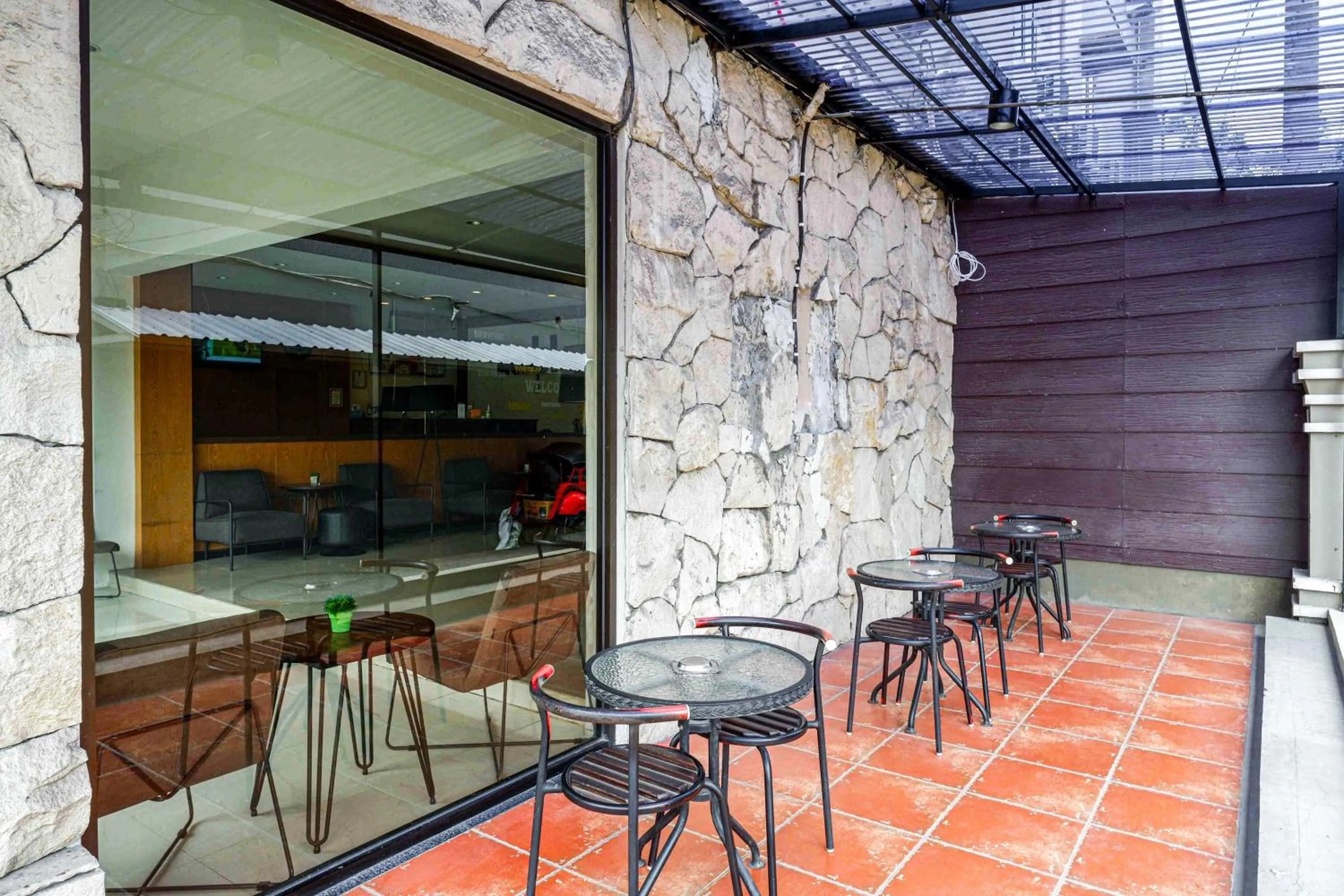 Seating area in Sans Hotel Ekkon Yogyakarta by Reddoorz