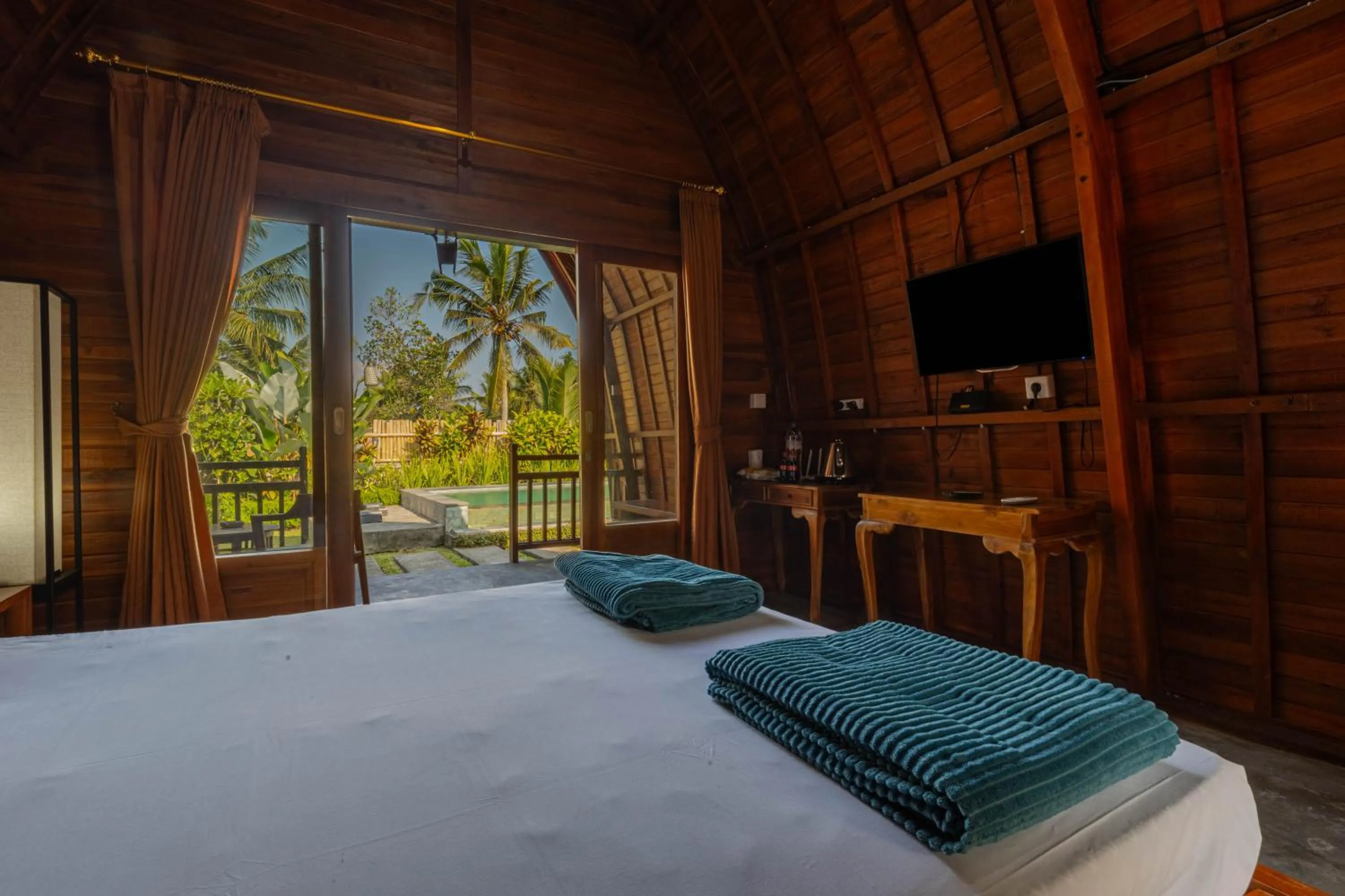 Bed in Kubu Selat Villa and Glamping